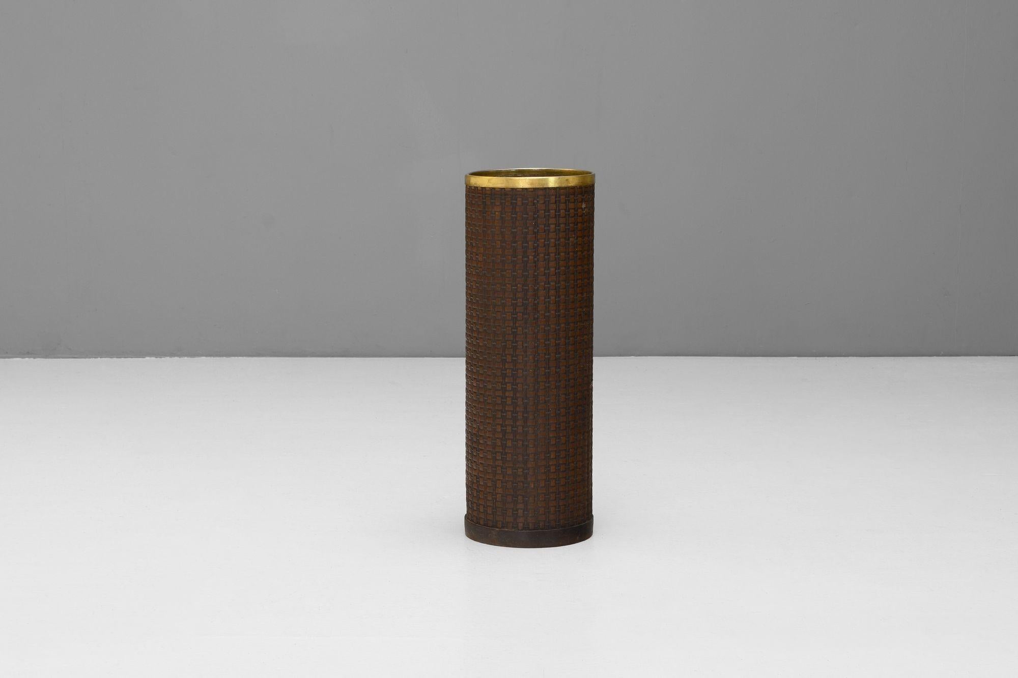 French mid-century umbrella stand in tooled leather with brass rim.
France circa 1960.
H 60cm x W 21cm x D 21cm