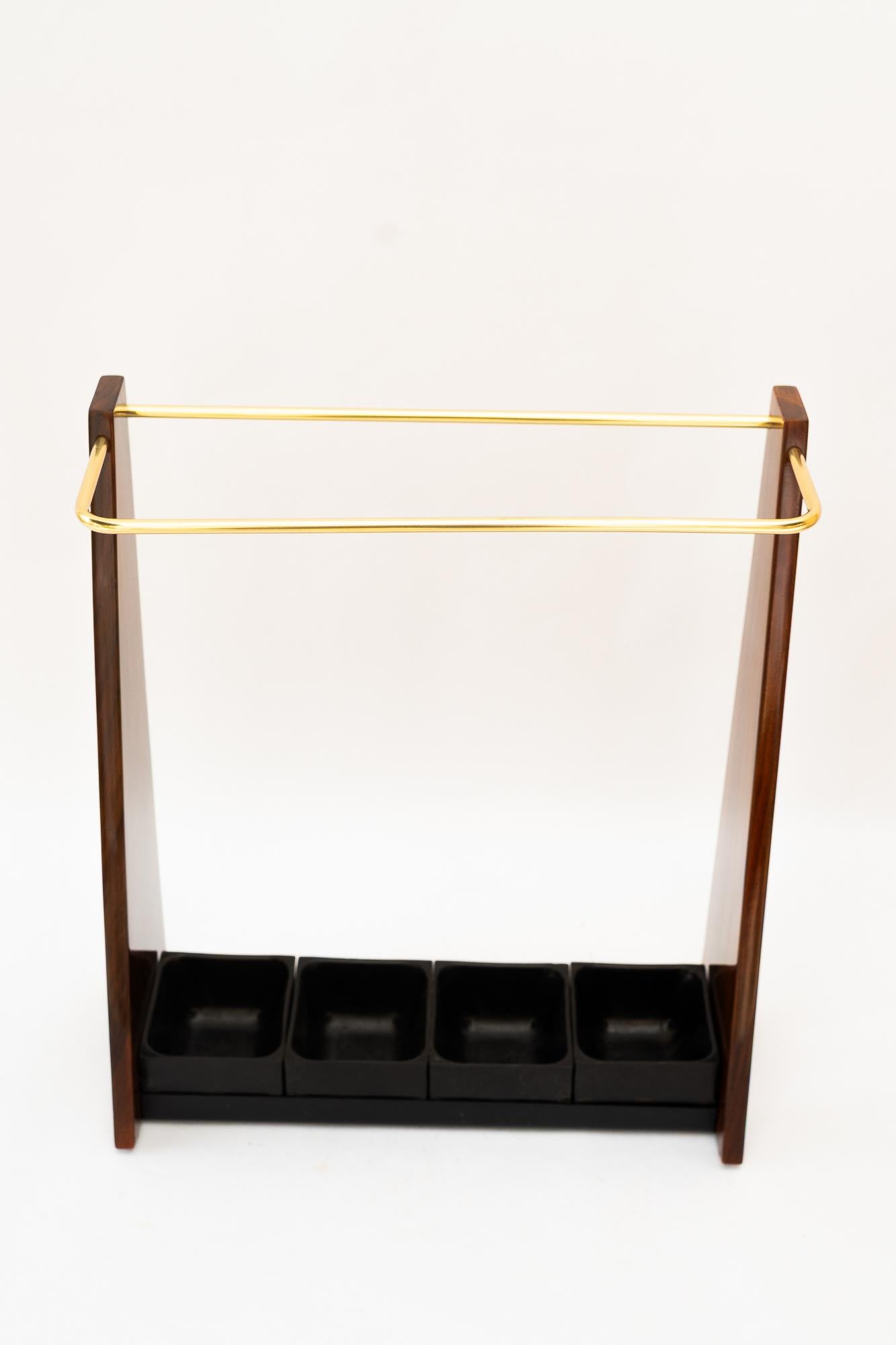 Umbrella Stand vienna around 1950s
Brass polished and stove enameled
Nutwood veneer
Plastic blackened ( original condition )
We have 2 pieces of them ( same )