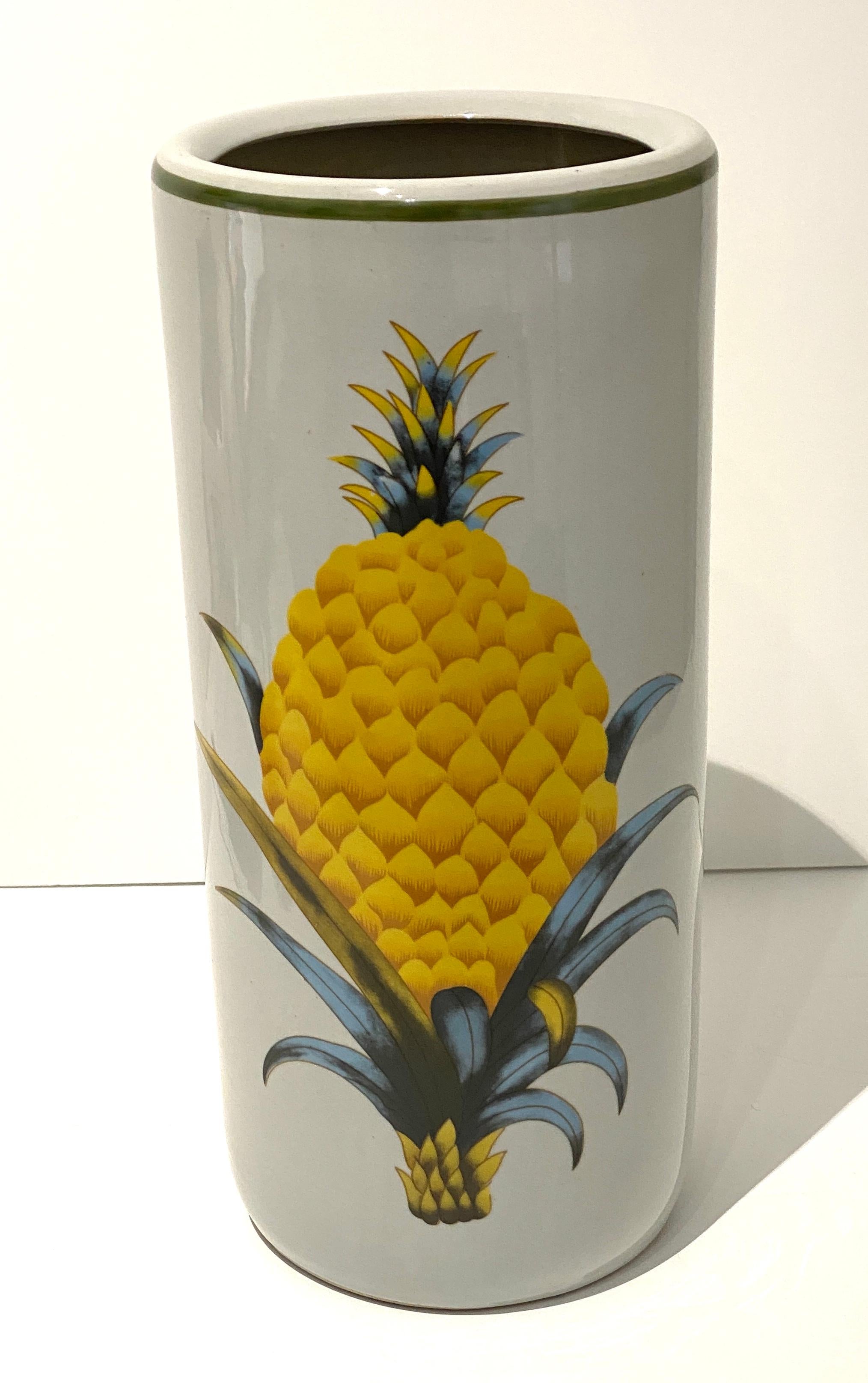This stylish umbrella urn with its pineapple medallion's will make a statment of welcome to your homes entry, or perhaps mudroom. 

Note: The pineapple medallion appears on two sides of the urn.