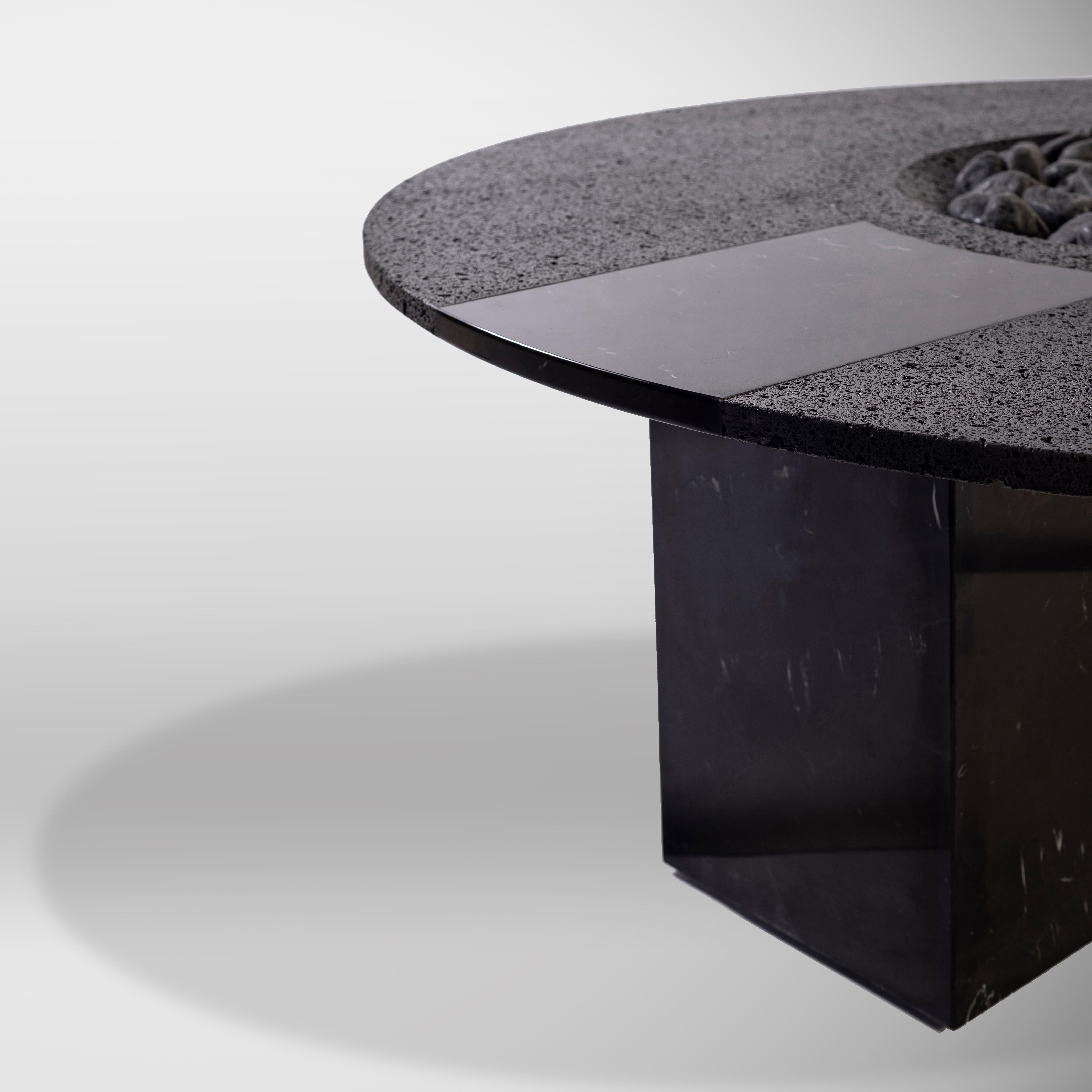UMO, a volcanic stone fire pit/sculpture created by expert craftspeople, armed by chisel and hammer, chipping away to create symmetry, balance, function, and form. Within this formidable monolithic simplicity and polished border highlight, UMO