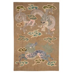 Tapisserie en soie brodée en relief représentant un dragon et un kirin