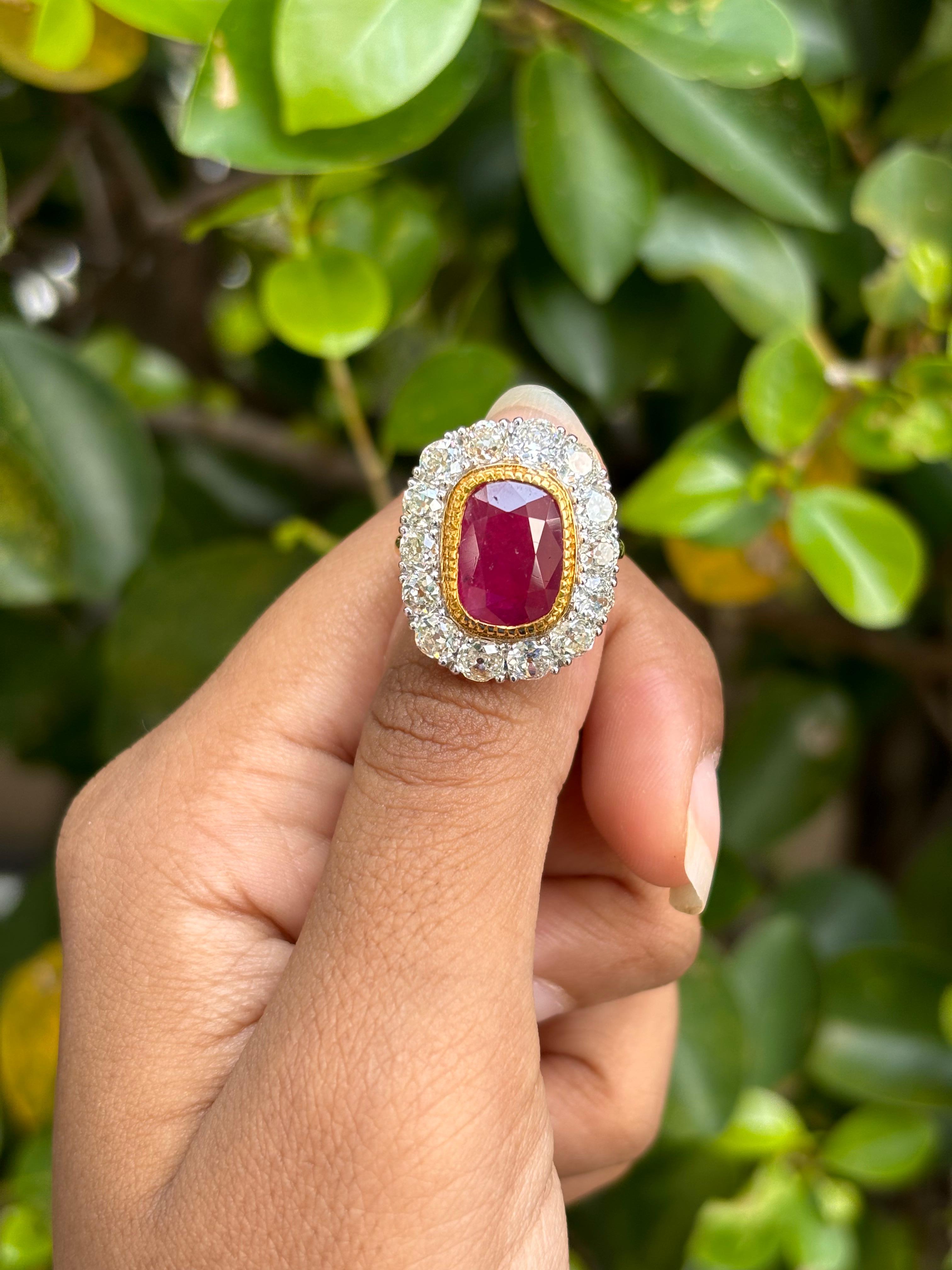 Introducing a stunning Art Deco masterpiece, a striking statement ring that showcases a remarkable 4.35 Carat unheated Ruby. Its perfect cushion shape and captivating red color exude an enchanting allure that radiates both indoors and outdoors.