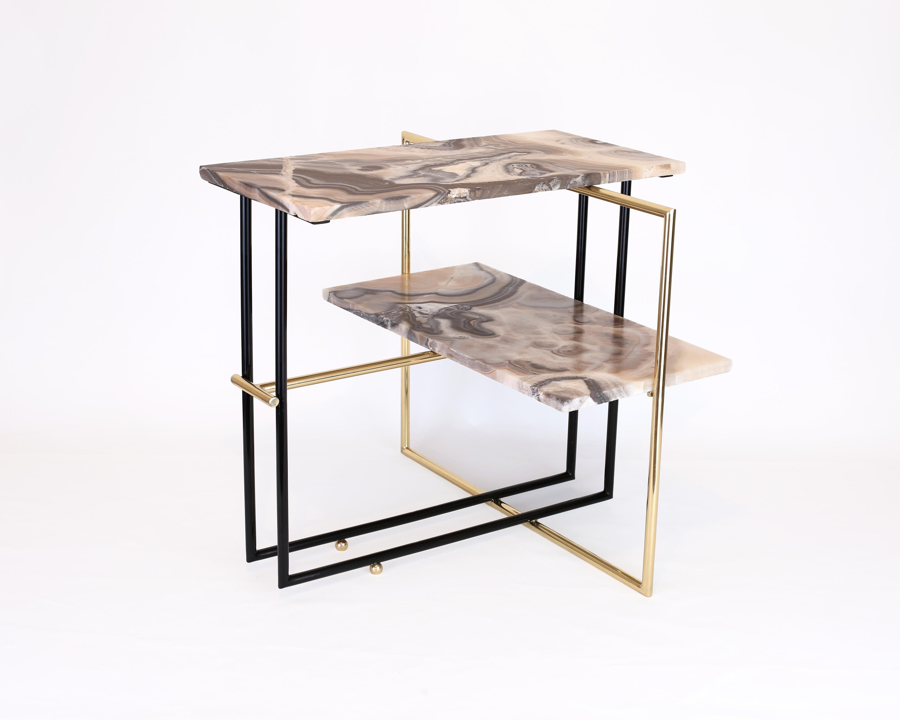 Uña side table by Nomade Atelier
Dimensions: D72 x W60 x H65 cm
Material: stone, Onyx
Weight: 20 kg

The UÑA table is fable, mythology and design blended together. The striking contrast between the stone’s solid weight and the apparent frailty