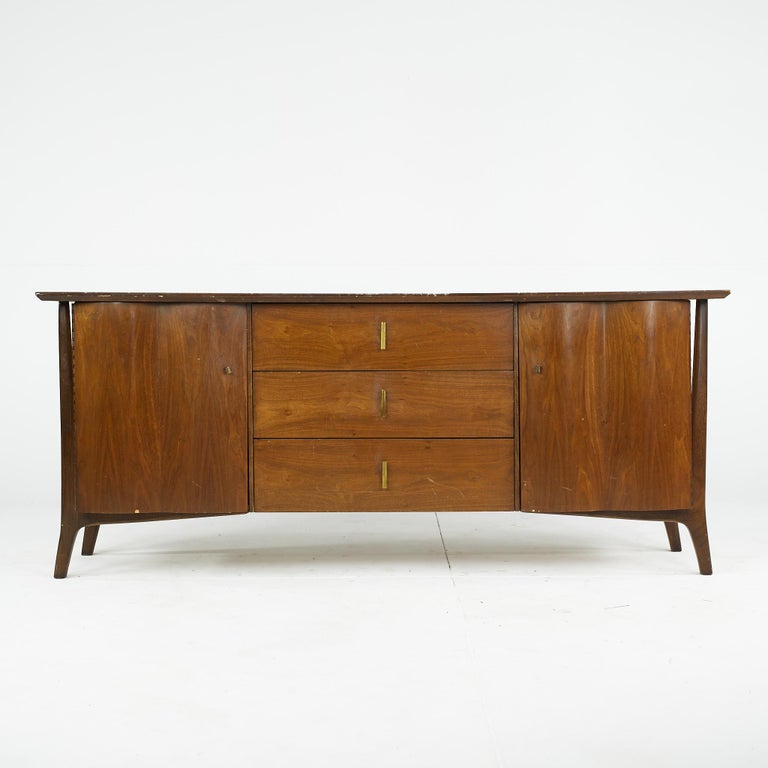 Unagusta Forward Furniture Mid Century Walnut Buffet Server Credenza

This credenza measures: 76 wide x 20.5 deep x 36 inches high

All pieces of furniture can be had in what we call restored vintage condition. That means the piece is restored