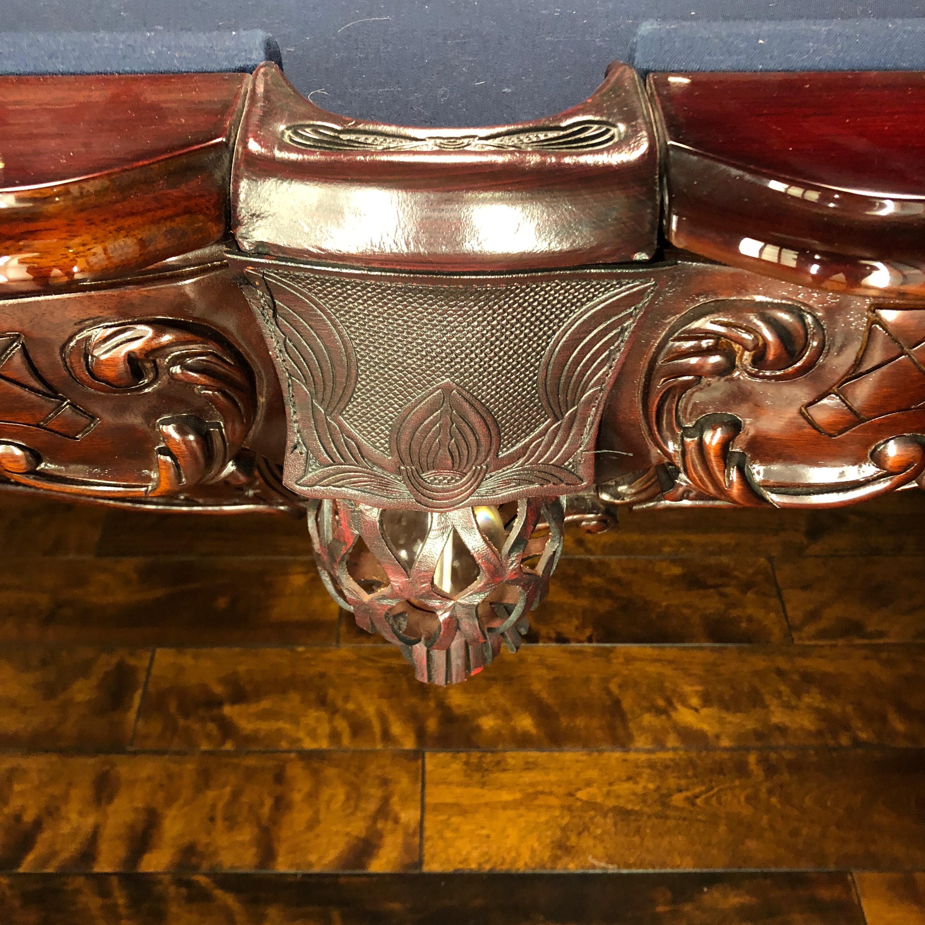 One of the most elaborate gorgeous billiard tables we've seen, a Charles Porter Renaissance Gobelins original having ornately carved mahogany with inlay mother of pearl diamonds around the periphery, leather clad pockets and over-sized carved legs.