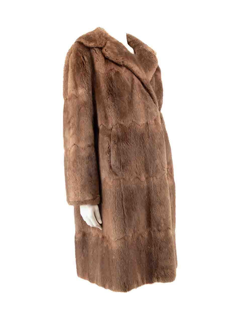 CONDITION is Good. General wear to coat is evident. Moderate signs of wear to front right sleeve and rear left sleeve where fur panel has come off as well as stitching is loosened. The lining seam of both sleeves are partly unstitched. There's small