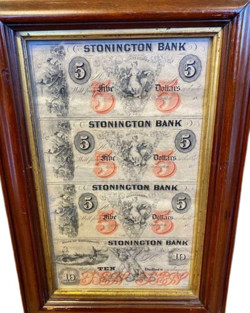 Uncut Sheet of Nautical Decorated Commercial Banknotes, Circa 1850s - 1860s, a polychromed printed sheet of obsolete commercial banknotes issued by the Stonington Bank of Stonington, Connecticut, in Five and Ten Dollar denominations. 

The Five