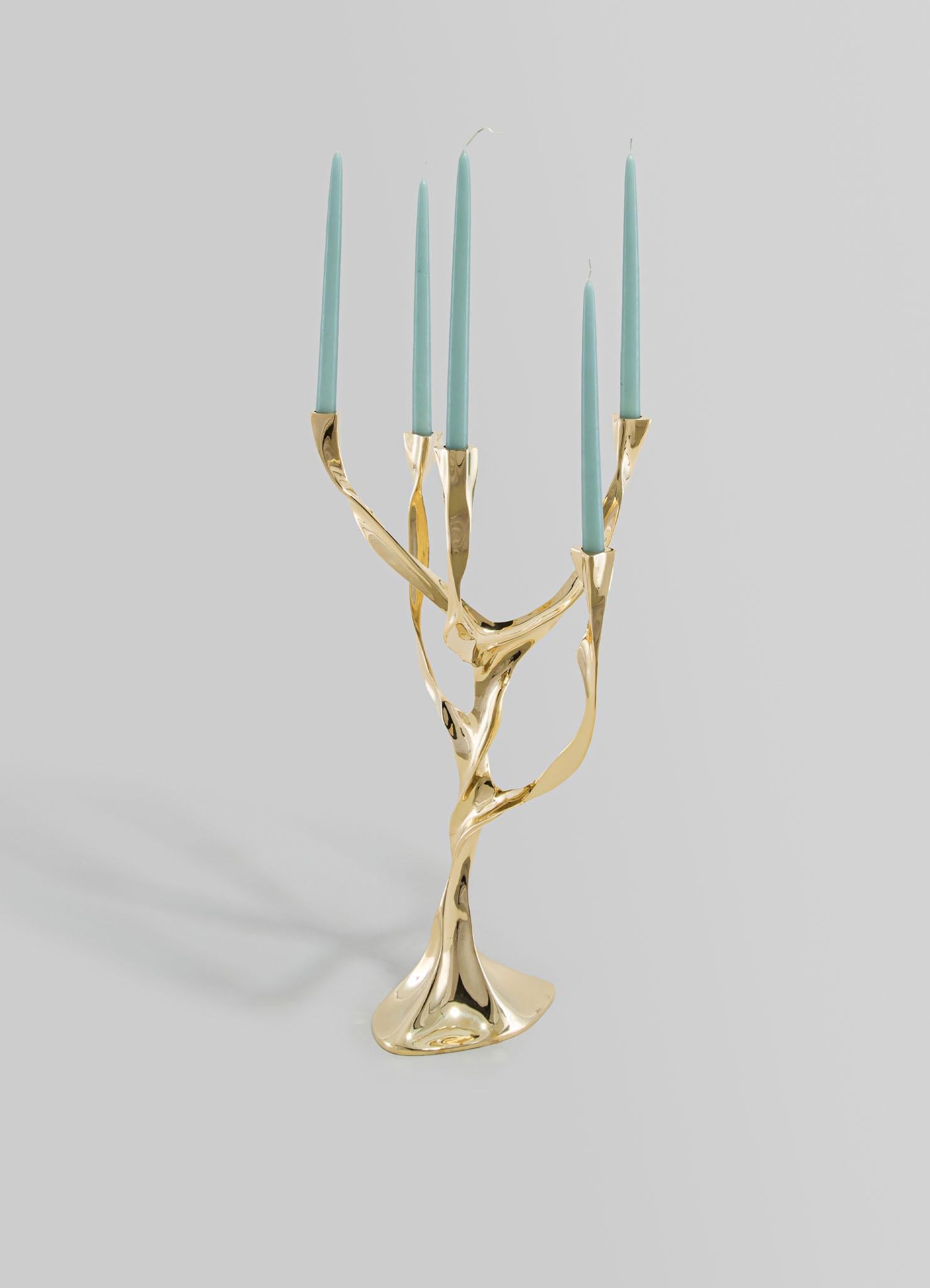 Under The Banyan Gold Candelabra in Brass, Viya by Vikram Goyal

Echoing ancient whispers of worship, each object captures the essence of the Banyan tree, believed to hold the divine power to fulfil wishes. Crafted with reverence, these pieces pay