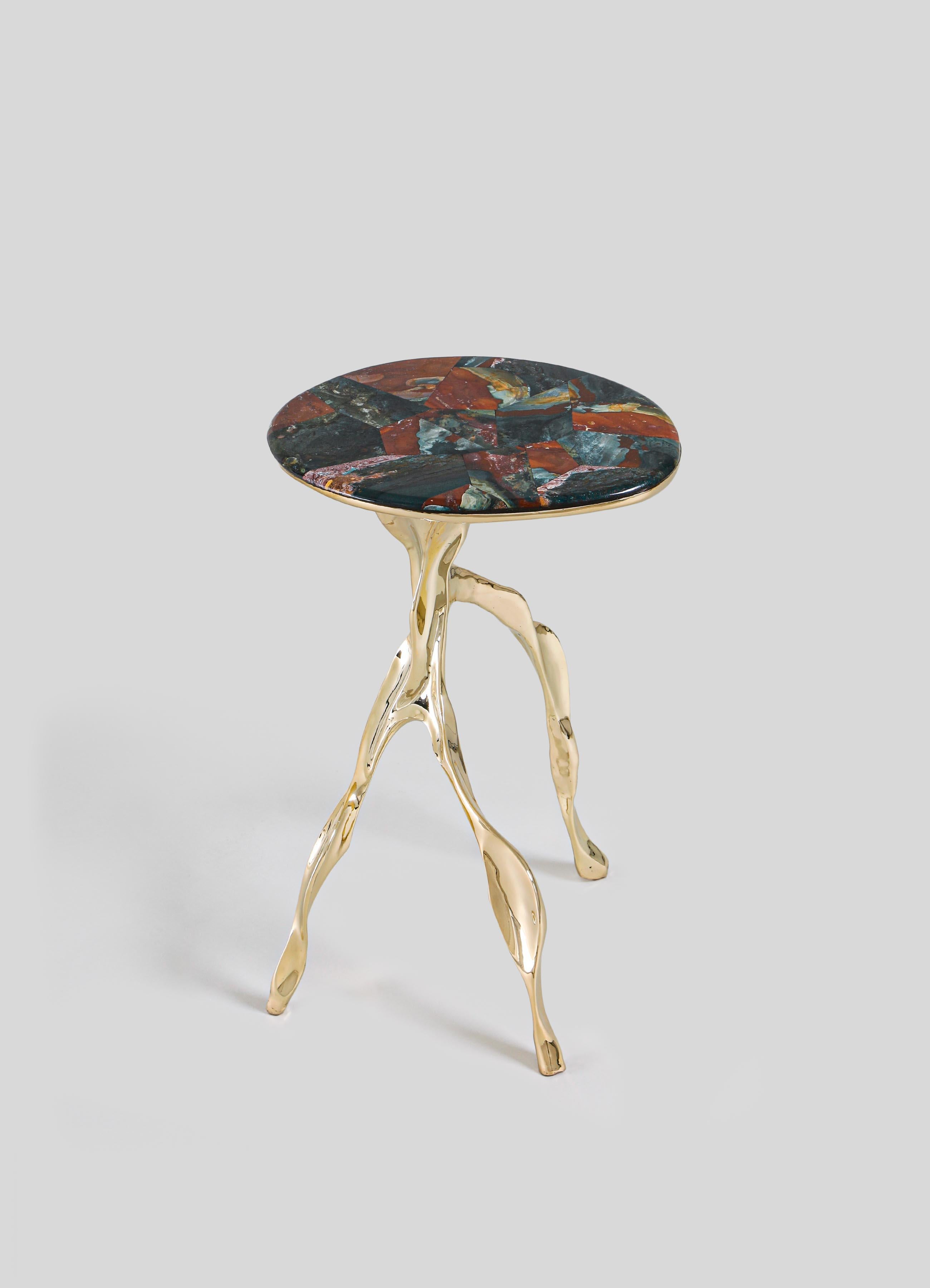 Under The Banyan Gold Side Table Large in Brass & Semi Precious Stone

Echoing ancient whispers of worship, each object captures the essence of the Banyan tree, believed to hold the divine power to fulfil wishes. Crafted with reverence, these brass