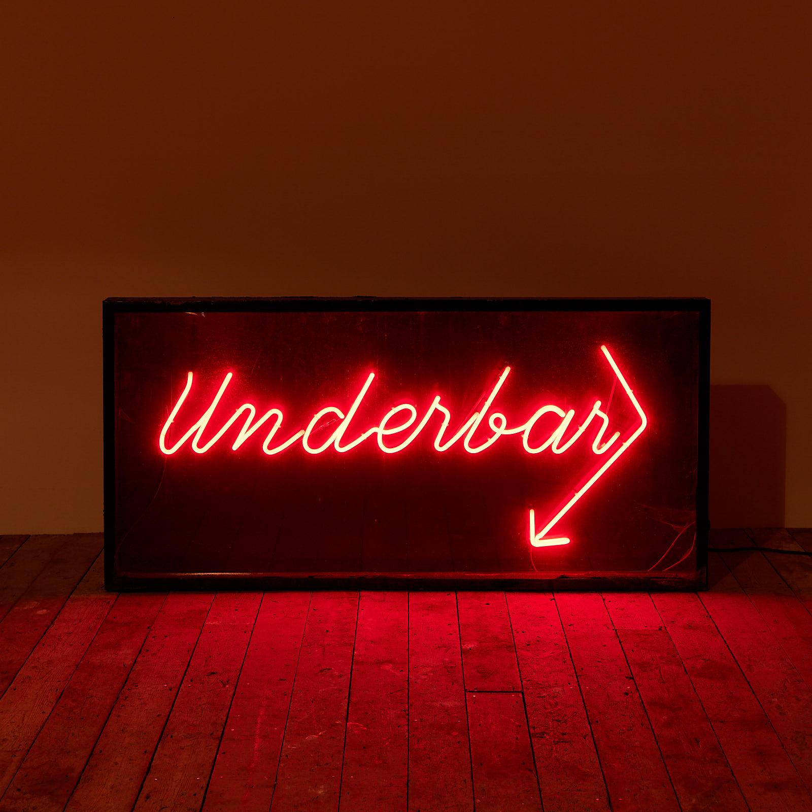 A 1960s red neon 'Underbar' sign, sourced from Hardy's Brasserie in Marylebone, London.

The black painted steel frame is pitted with areas of rust, but structurally sound. The paint work is bubbling up in spots. The glass is sound, with minor
