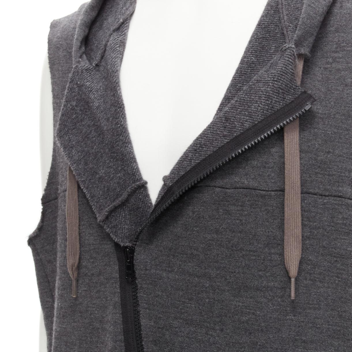 UNDERCOVER 2007 wool angora blend raw edge sleeve hooded vest JP3 L
Reference: CAWG/A00297
Brand: Undercover
Collection: FW 2007
Material: Wool, Angora, Blend
Color: Grey
Pattern: Solid
Closure: Zip
Made in: Japan

CONDITION:
Condition: Excellent,