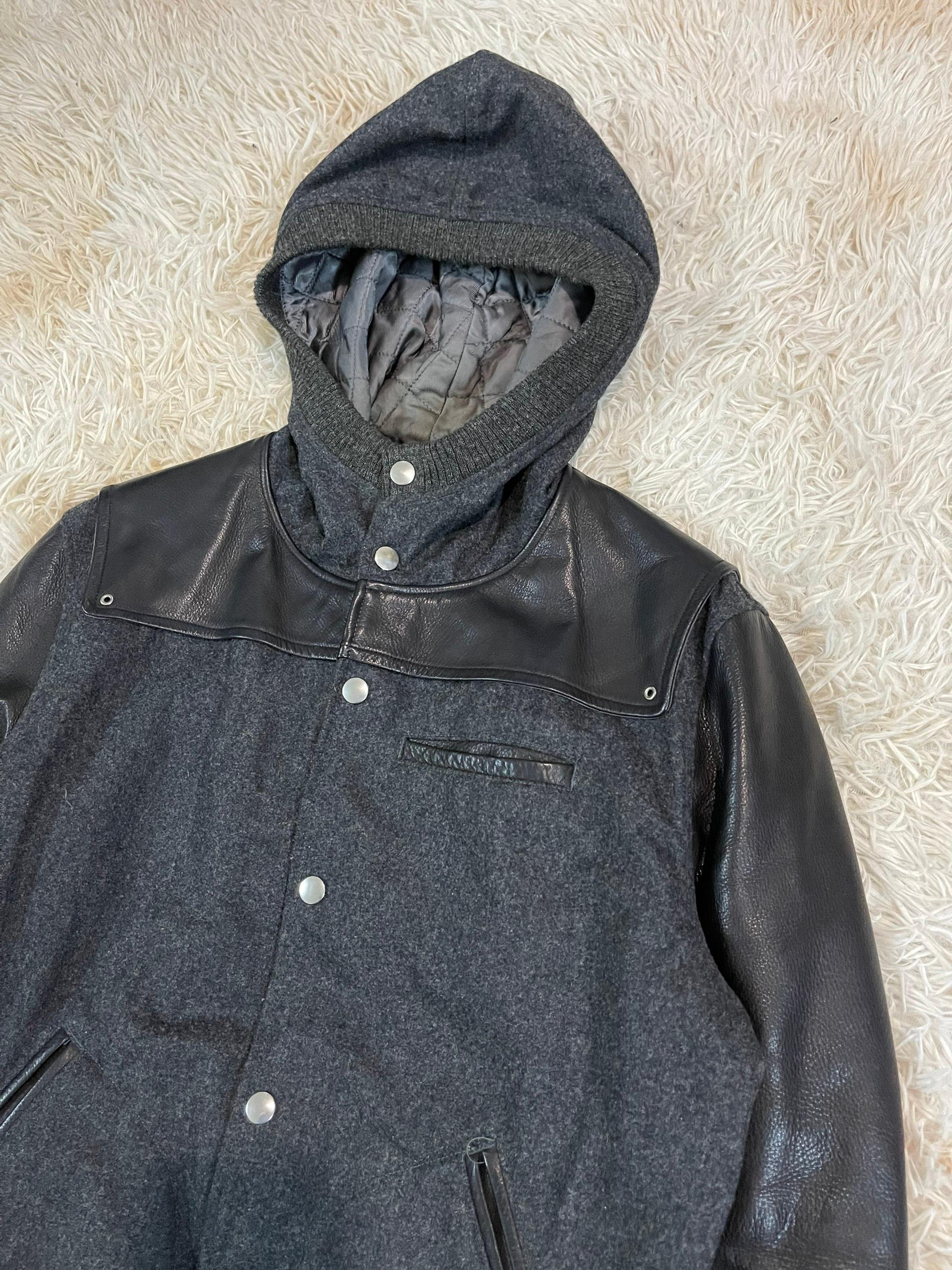 Amazing mixed composition of a padded body, wool hood with knit wool sleeve, along with a full cupro lining.

Other details include embroidered leather , two internal chest pockets, and a small outer chest pocket. Made in Japan. 

Size: 3, fits M to