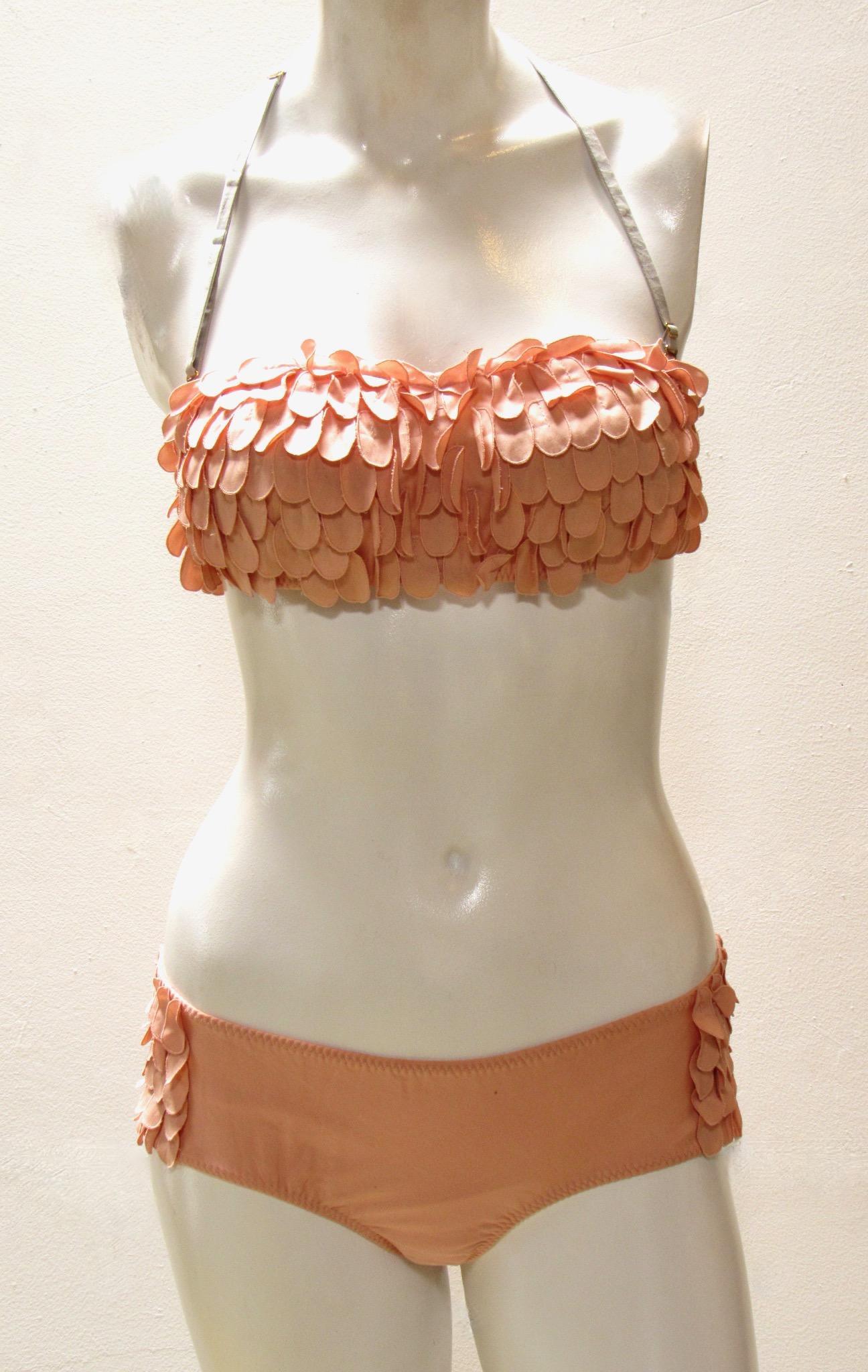 This extraordinary bikini from vintage Undercover flutters in with pink cotton with brass hardware. The top has a removable strap and the hipster bottoms are low cut with full coverage in back. 
