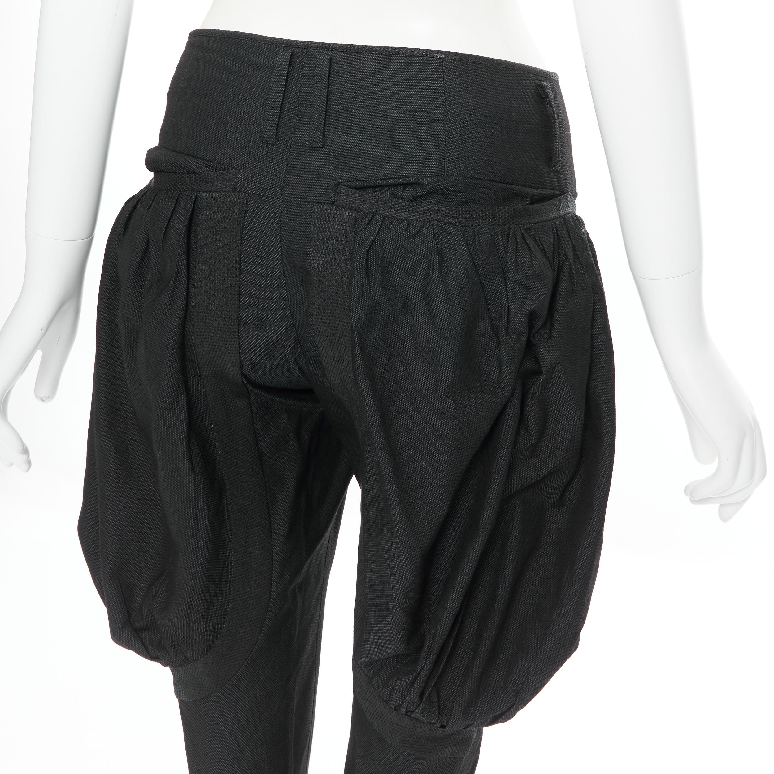 UNDERCOVER black wool silk pleated exaggerated pockets jodphur riding pants M 
Reference: CAWG/A00207 
Brand: Undercover 
Material: Wool 
Color: Black 
Pattern: Solid 
Closure: Zip 
Extra Detail: Wool silk blend. Black. Zip fly. Pleated voluminous