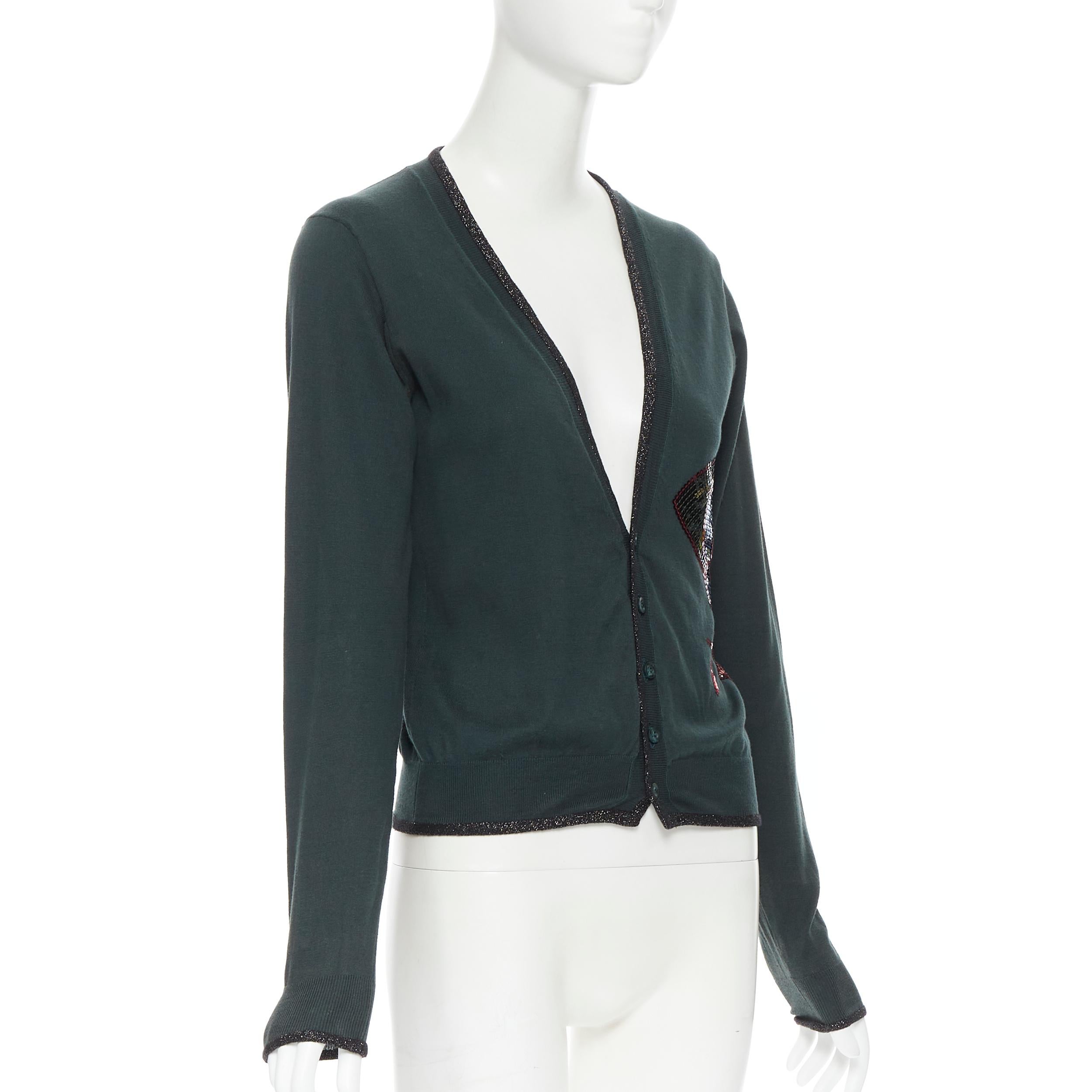 UNDERCOVER dark green cotton sequins floral patch lurex trimmed cardigan JP1 S 
Reference: CAWG/A00177 
Brand: Undercover 
Material: Cotton 
Color: Green 
Pattern: Solid 
Closure: Button 
Extra Detail: Lurex black trimming. Button front closure.