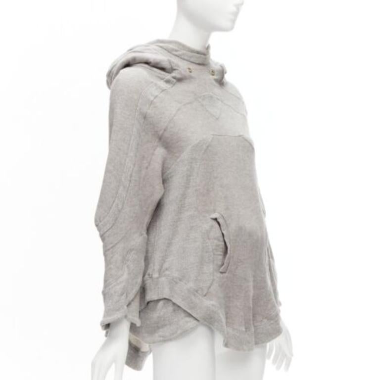 UNDERCOVER grey cotton wool panelled sleeves oversized hooded sweatshirt JP1 S
Reference: CAWG/A00270
Brand: Undercover
Material: Cotton, Wool
Color: Grey
Pattern: Solid
Closure: Pullover
Extra Details: Could be worn for a grunge layered look.
Made