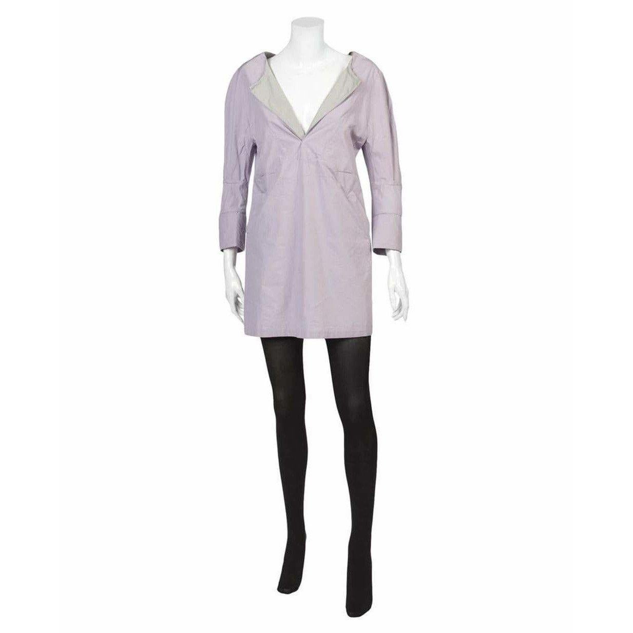 Lovely in lilac! This shirt dress from vintage Undercover features contrasting grey lapels, 3/4 length folded sleeves, two slanted front pockets, and a double back vent. This comfortable 100% cotton dress can also be styled as a tunic.