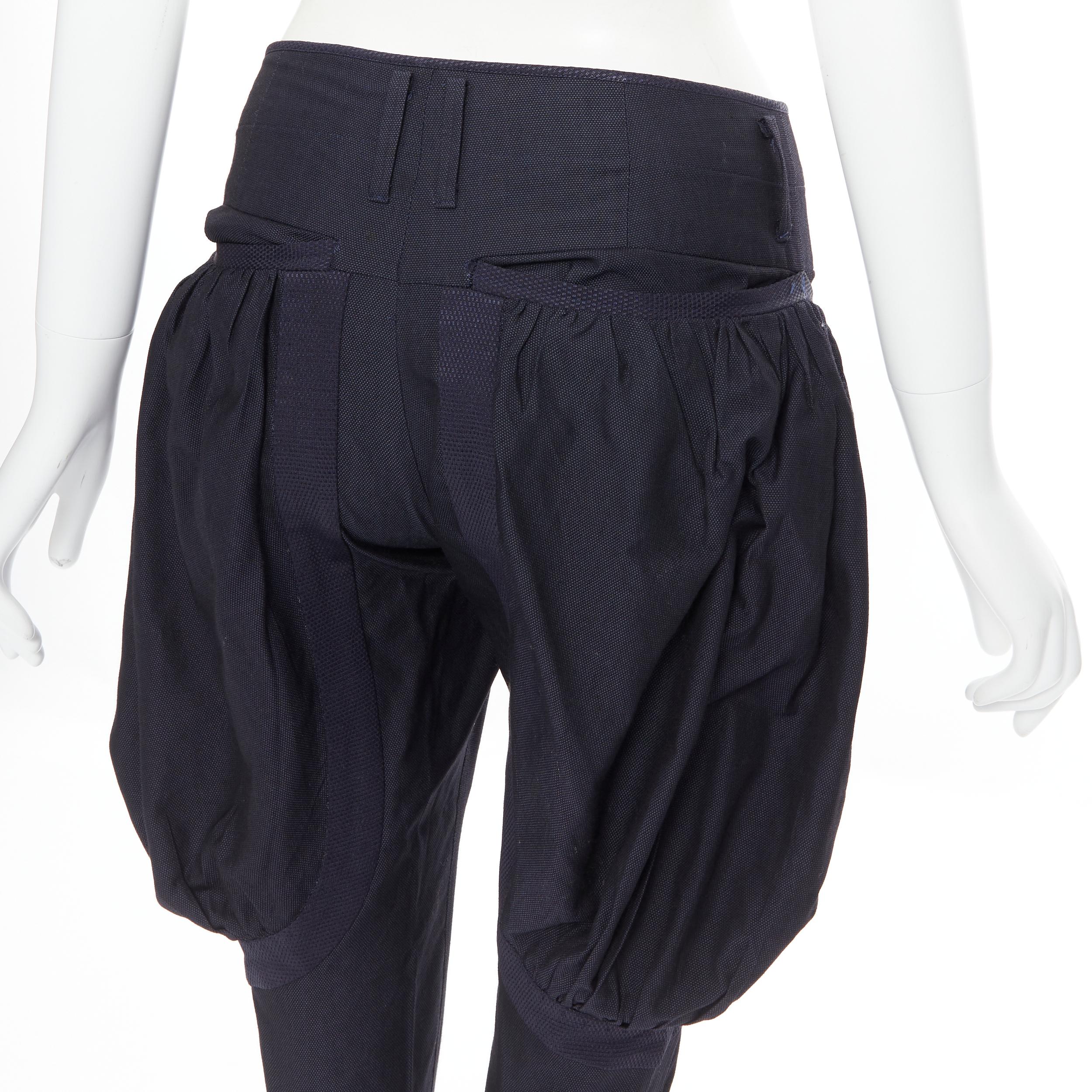 UNDERCOVER navy wool silk pleated exaggerated pockets jodphur riding pants M 
Reference: CAWG/A00206 
Brand: Undercover 
Material: Wool 
Color: Navy 
Pattern: Solid 
Closure: Zip 
Extra Detail: Wool silk blend. Navy blue. Zip fly. Pleated voluminous