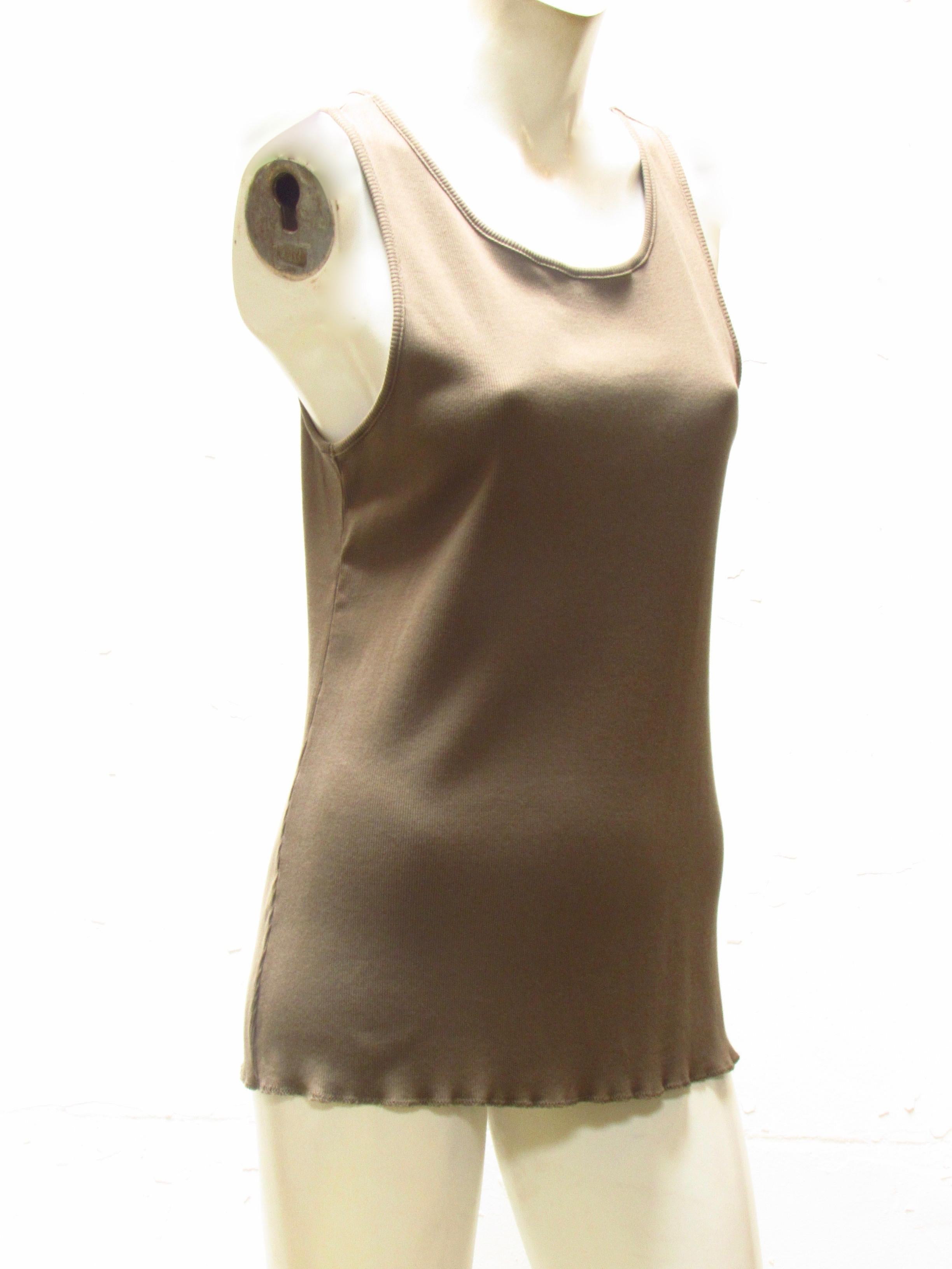 100% cotton ribbed scoop neck tank top comes to you from vintage Undercover. This mocha tank falls to natural hip. The front straps wrap around, halter-like in back where straps connect in racerback style. 