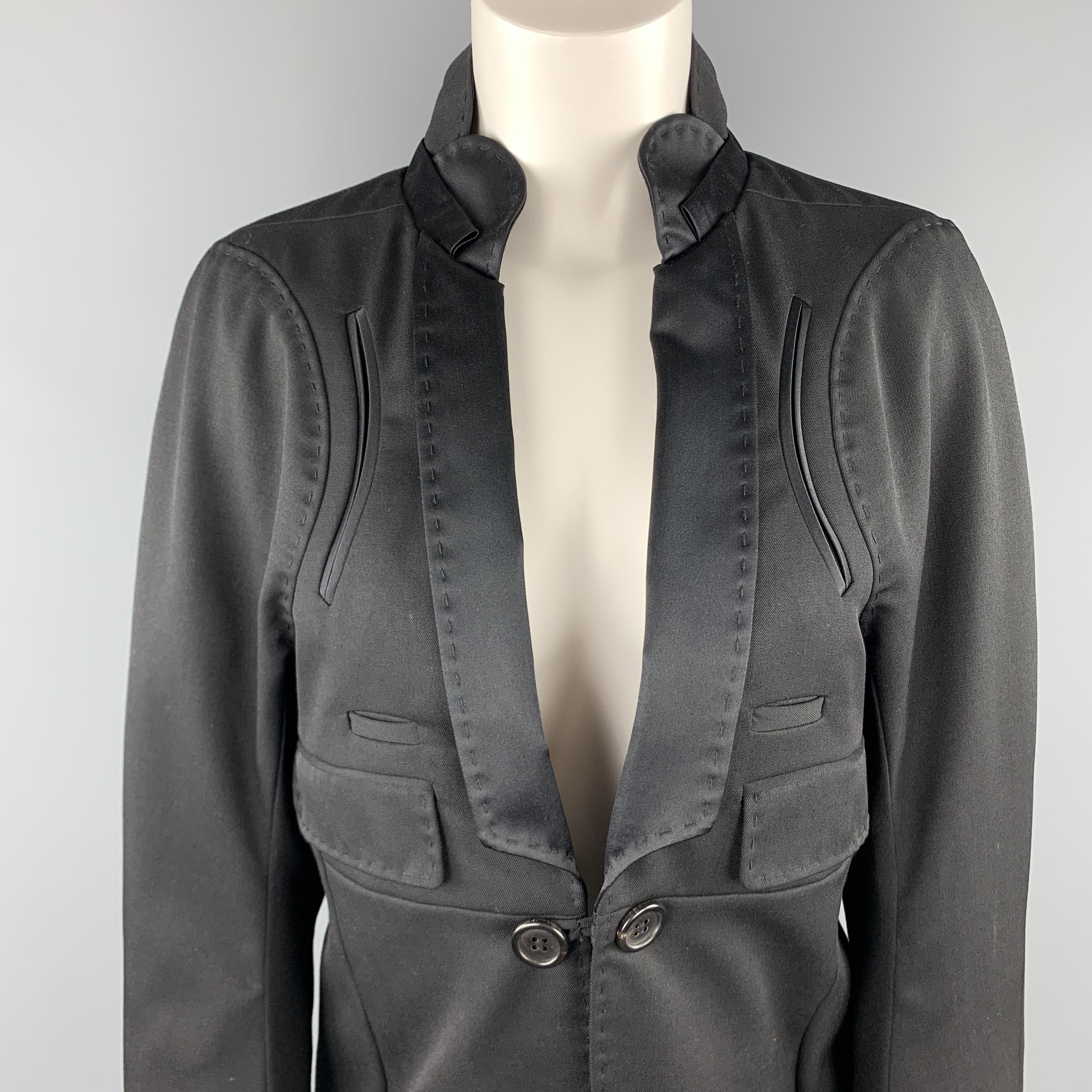 UNDERCOVER tuxedo style coat comes in black wool with a single button front, high back collar with satin shawl lapel, pocket details, and coat tail style hem line. Made in Japan.

Excellent Pre-Owned Condition.
Marked: JP 3

Measurements:

Shoulder: