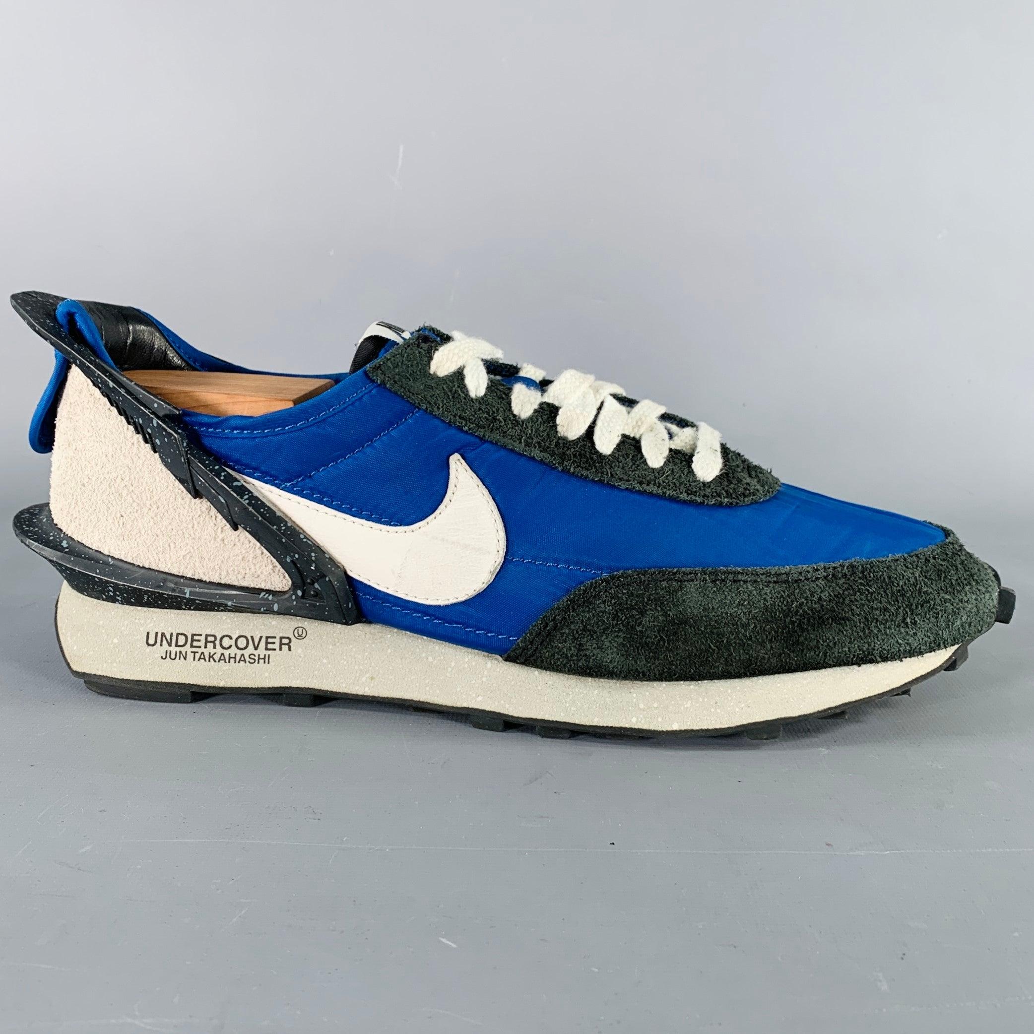 UNDERCOVER x NIKE sneakers
in a blue nylon and black suede featuring structural speckled rubber details, and lace-up closure. Shoe trees not included.Very Good Pre-Owned Condition. Minor signs of wear. 

Marked:   BV4594-400Outsole: 11.25 x 4.25