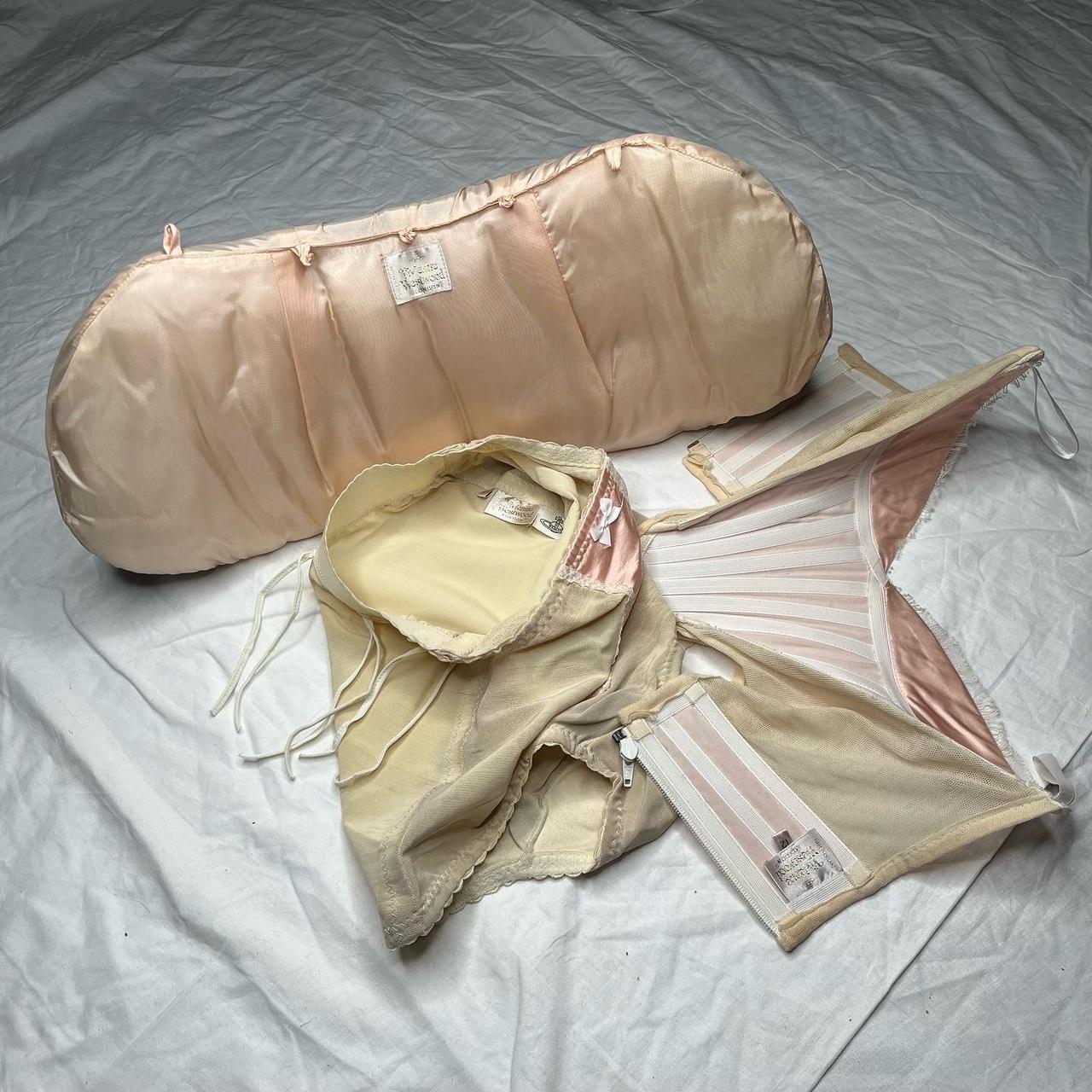 This Vivienne Westwood undergarment set is a breathtakingly beautiful piece of history. In a peach pink hue, it is inspired by Victorian fashion and is truly museum worthy. Its archival design and quality fabric make it a timeless piece that will