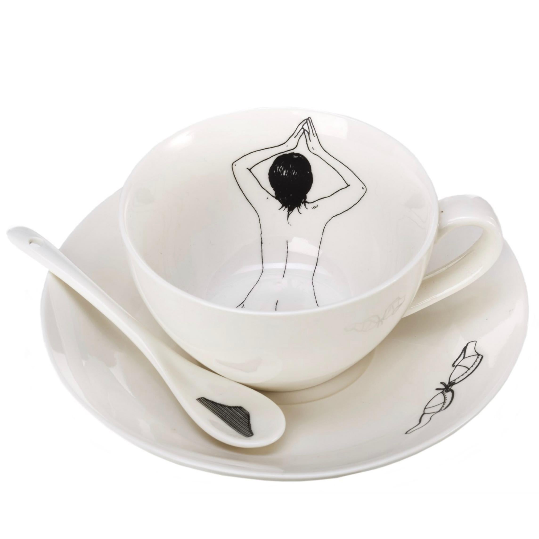 The undressed tea set was designed and handcrafted in the Netherlands by Esther Hörchner. Each cup features a line illustration of a nude woman in different positions as if bathing in the tea or coffee. The set is made complete with four spoons with