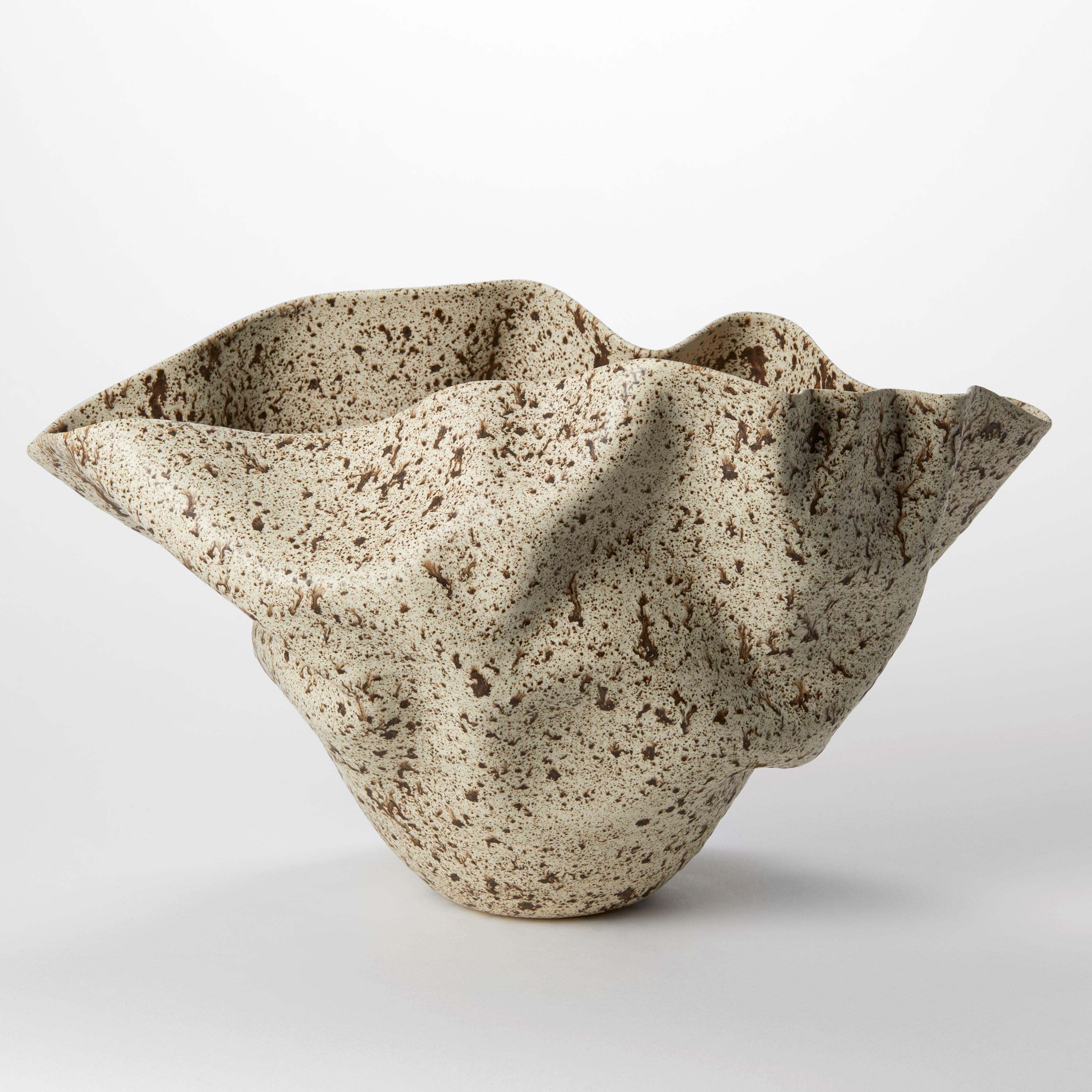 'Undulating Form in Speckled Glaze No 145’ is a unique sculptural vessel by the British artist, Nicholas Arroyave-Portela.

Nicholas Arroyave-Portela’s professional ceramic practice began in 1994. After 20 years based in London, he moved and set up