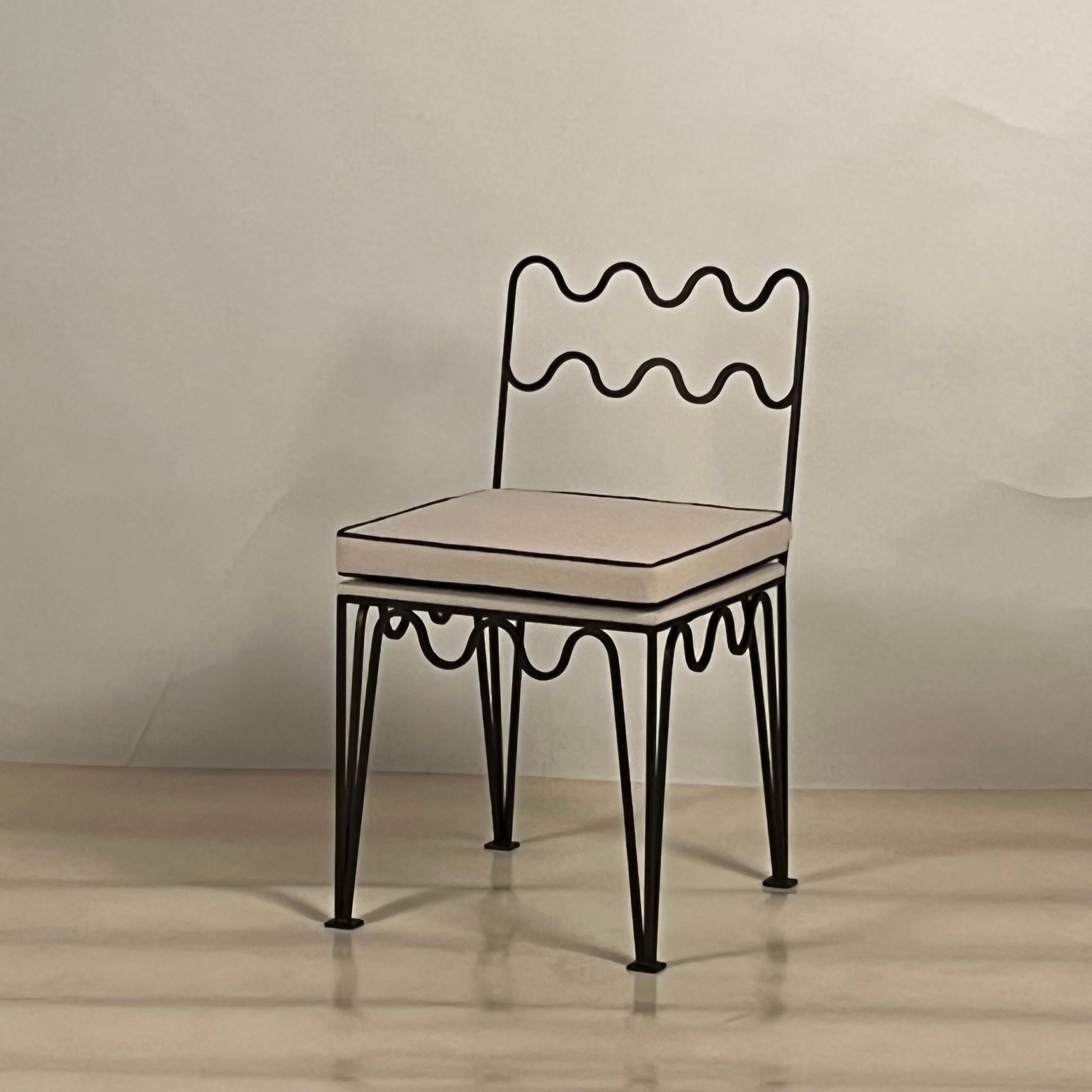 Undulating dark bronze 'Méandre' chair by Design Frères.

Chic and understated.