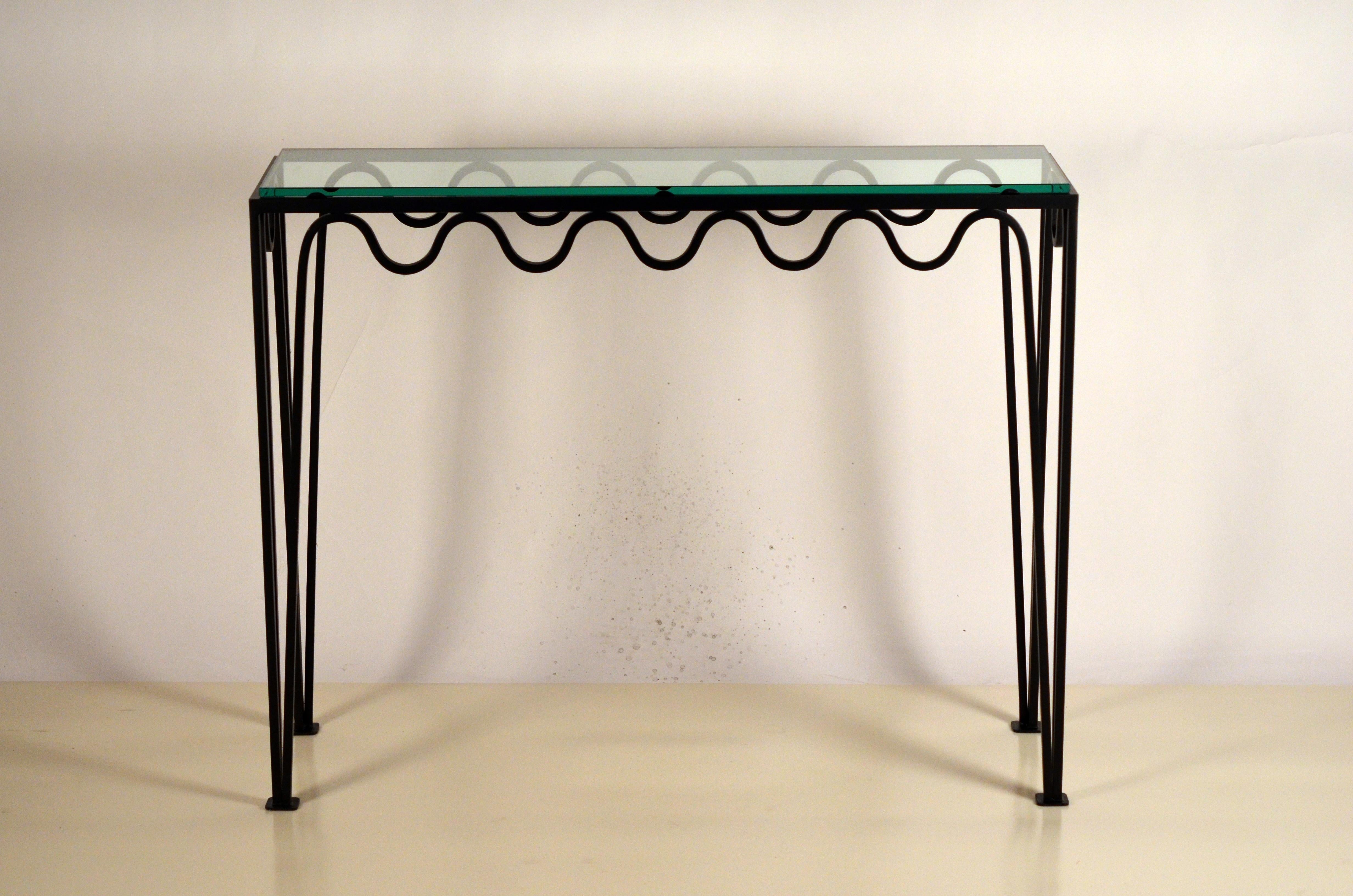 Undulating blackened iron and glass console by DESIGN FRÈRES.

These Méandre™ consoles from our exclusive DESIGN FRÈRES® line are handmade in our Los Angeles atelier by our skilled artisans. These classic pieces will blend in, structure and enhance