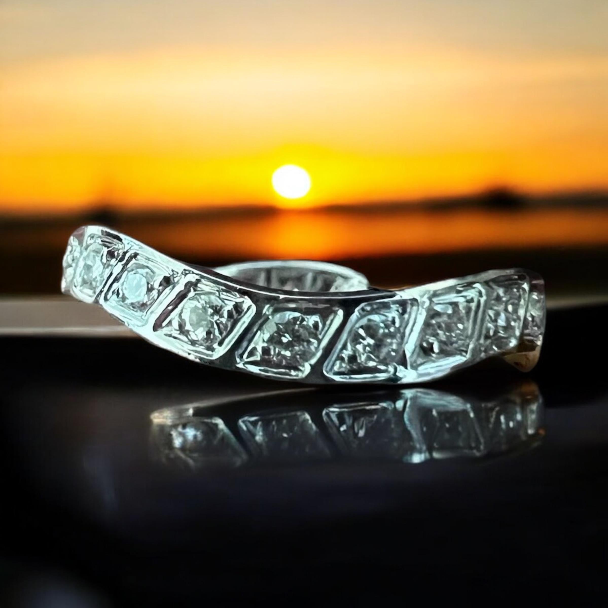 Undulating Vintage diamond white gold eternity band ring size 6.25, circa 1960s.

This unique vintage diamond 18k white gold eternity band size 6.25 is very wearable.  You can wear it with an engagement ring that bows out or with almost any