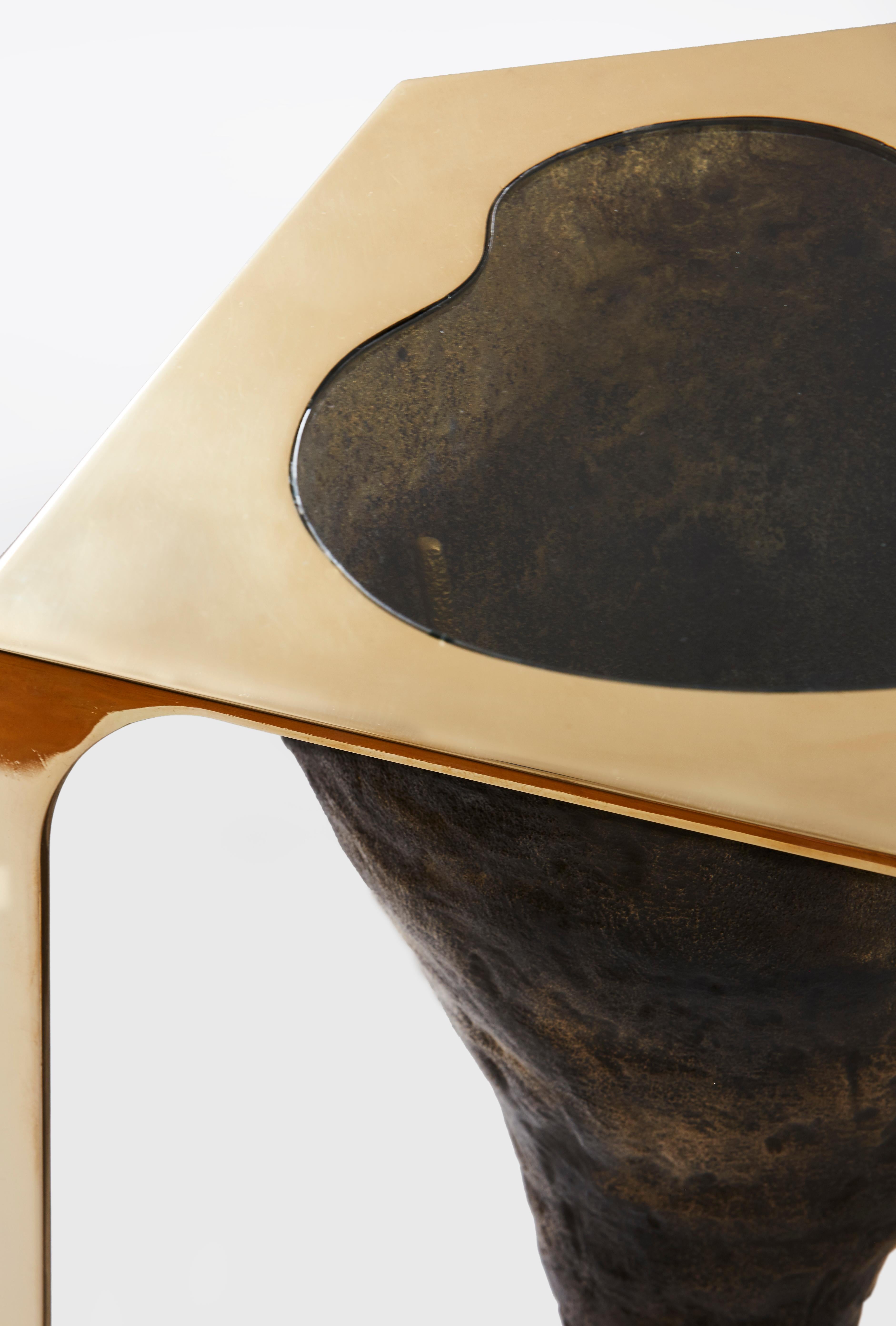 Unearth table in bronze, glass and brass by Cam Crockford 

Materials: Sand cast bronze - brass - glass
Dimensions: 13 W x 12.5 D x 17 H inches.