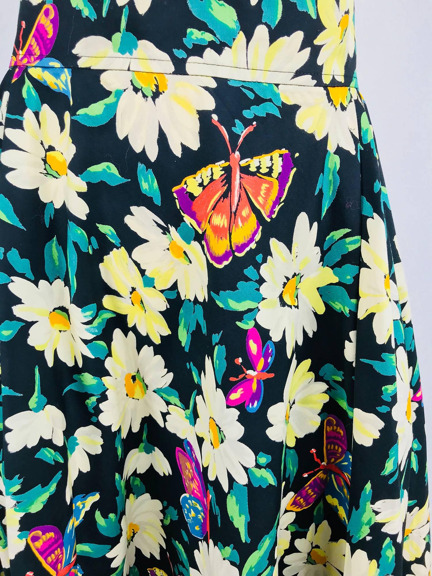 Ungaro cotton floral butterfly print high waist full skirt from the 1980s...This beautiful skirt has an amazing print of lush flowers with brightly coloured butterflies, the wide waist band sits at and above the natural waist. The full skirt has