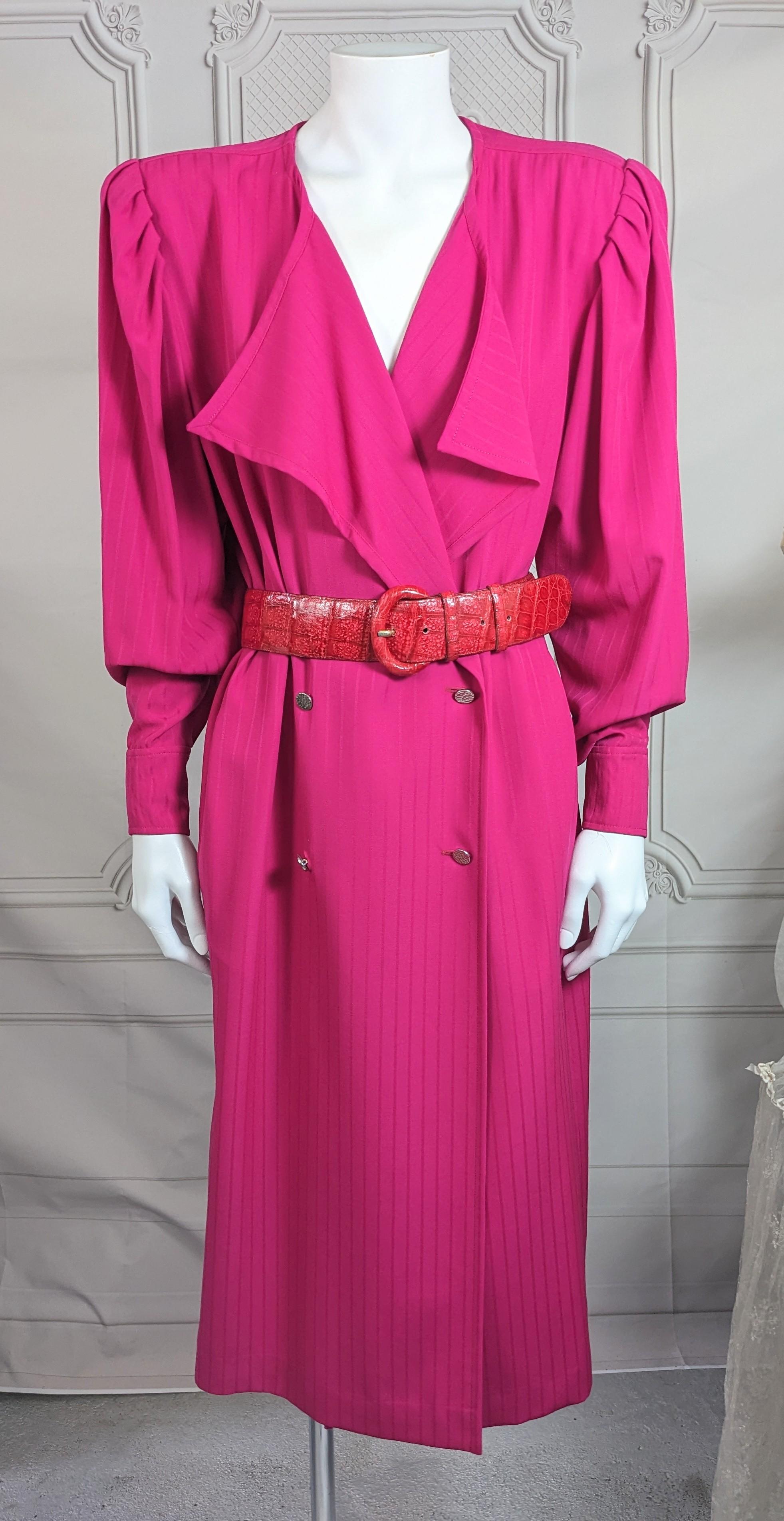 Elegant Ungaro Wool Fuschia Gabardine Strong Shoulder Dress from the 1980's. Double breasted style with hammered silver buttons. Sleeves are leg of mutton style with tapered cuffs. Straight cut on dress which works well belted with soft, open draped