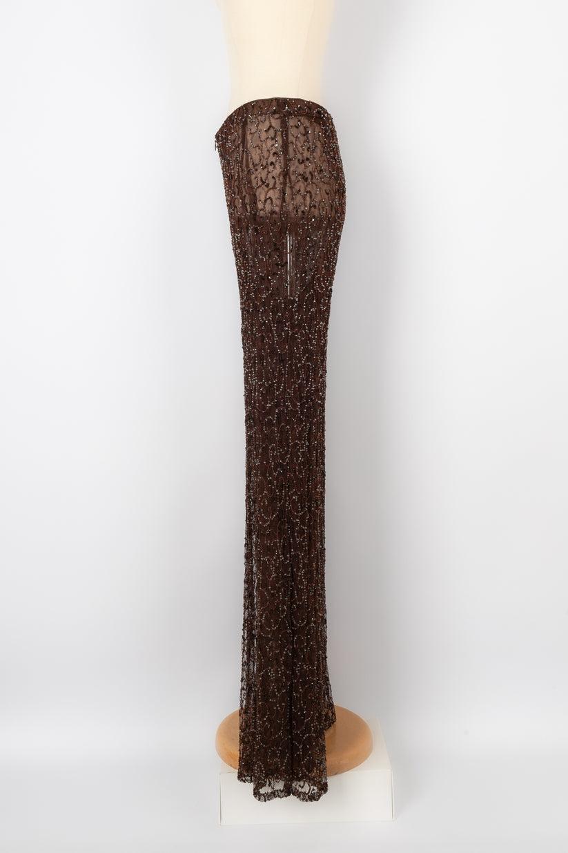 Ungaro - Fishnet Haute Couture pants embroidered with pearls. No size indicated, it fits a 34FR.

Additional information:
Condition: Very good condition
Dimensions: Waist: 35 cm - Hips: 45 cm - Length: 110 cm

Seller Reference: FJ64