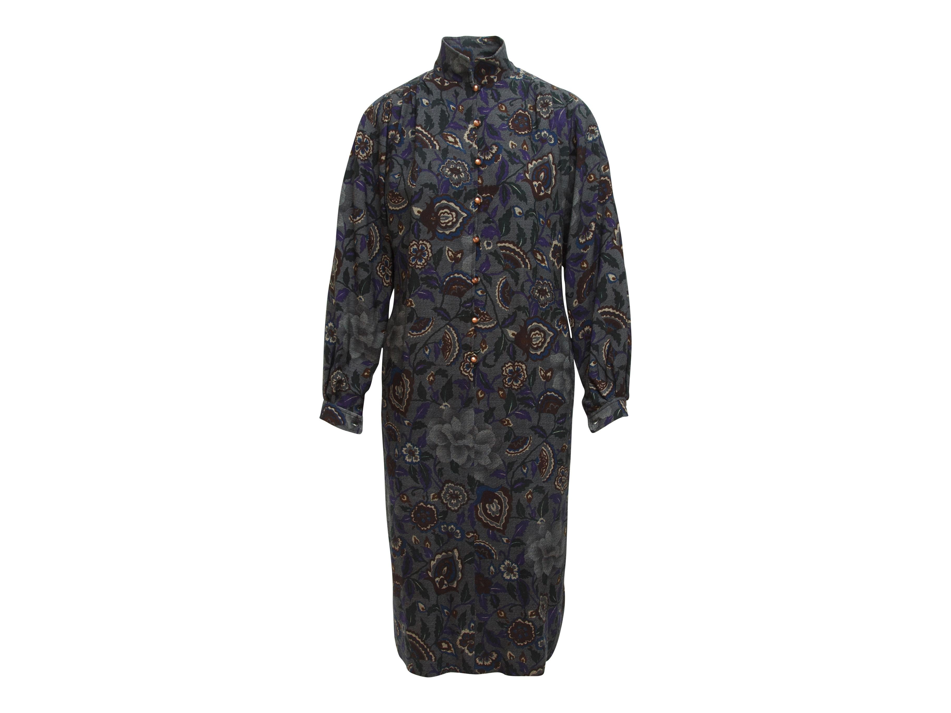 Product details:  Vintage multicolor floral-printed dress by Ungaro.  Stand collar accented with black velvet bow.  Long sleeves.  Single button cuffs.  Button-front closure.  30