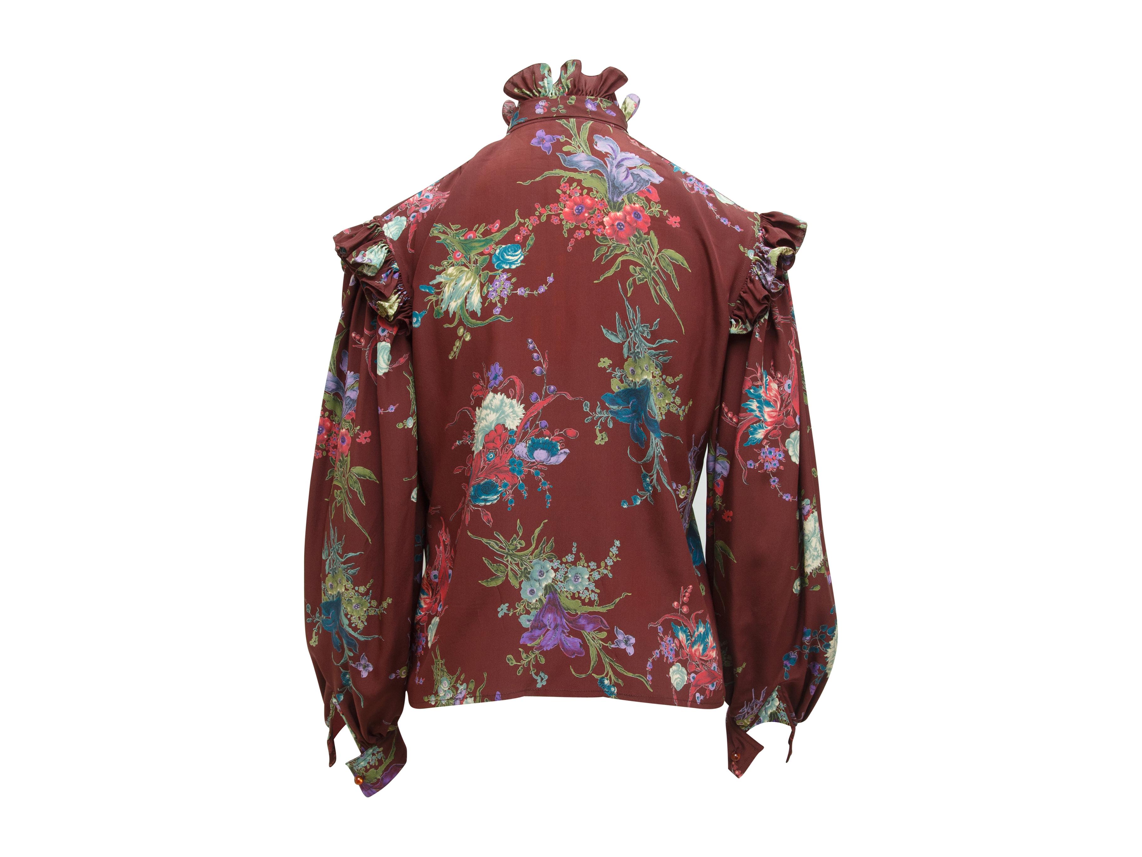 Product details:  Vintage multicolor floral-printed silk blouse by Ungaro.  Ruffled stand collar with tie.  Long sleeves.  Single button cuffs.  Button-front closure.  39