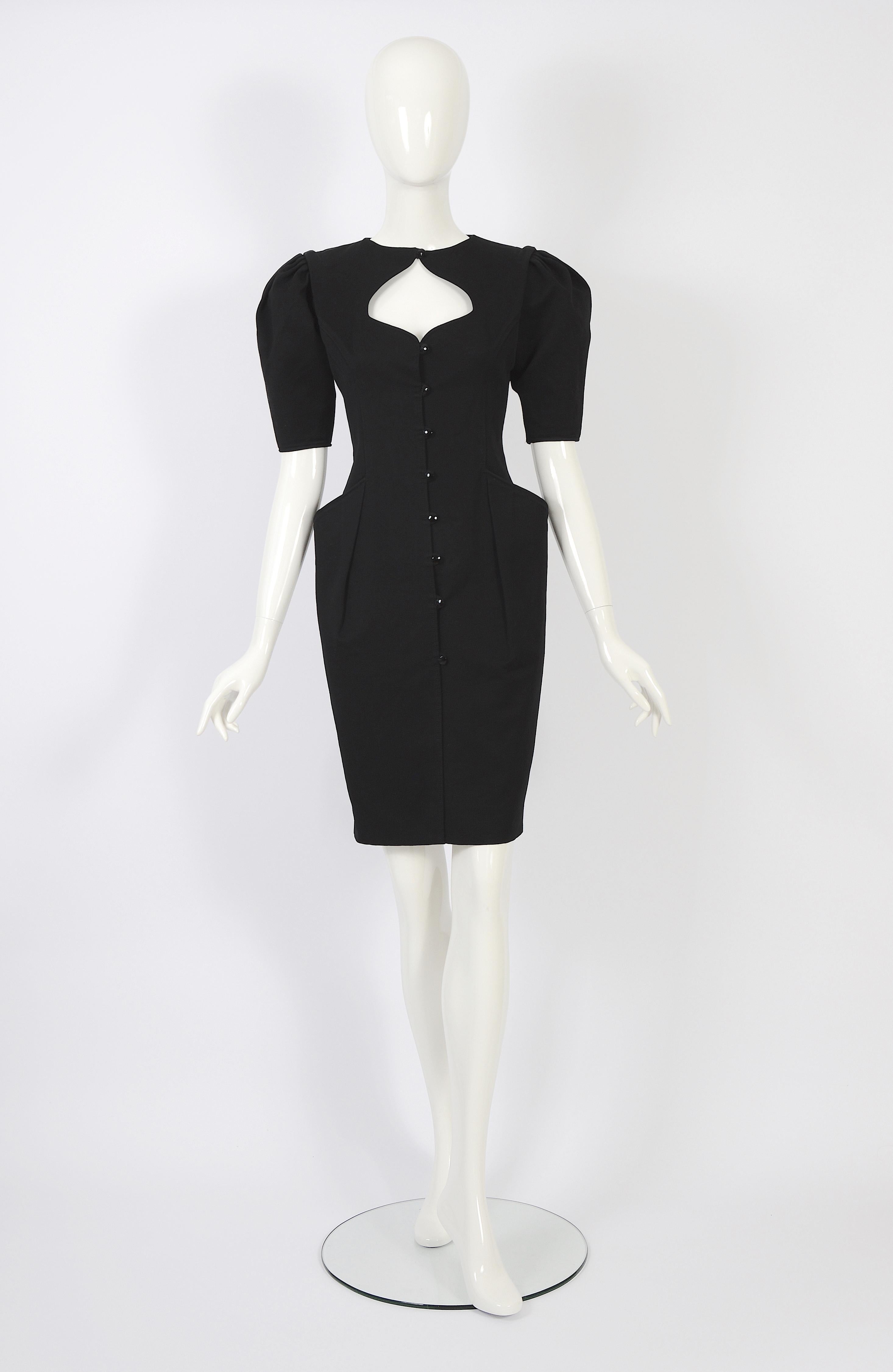 This is an adorable little dress designed by Emanuel Ungaro for Ungaro Parallele. It's a size 36, and our doll is quite tall, so the dress length falls more towards the knee or just below. The dress features elegant black diamond-cut buttons for