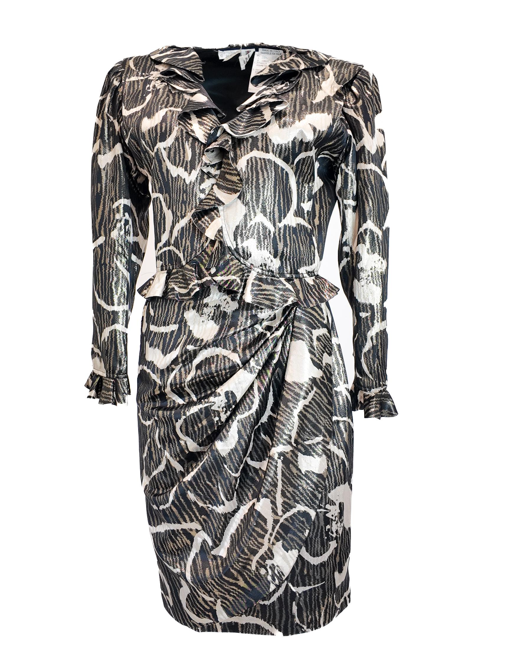 This Ungaro Parallele Paris skirt set features luxurious brocade silk fabric, combining a chic cropped jacket with a knee-length skirt. The metallic finish adds a sophisticated shimmer, making it an impeccable choice for upscale events. Designed to