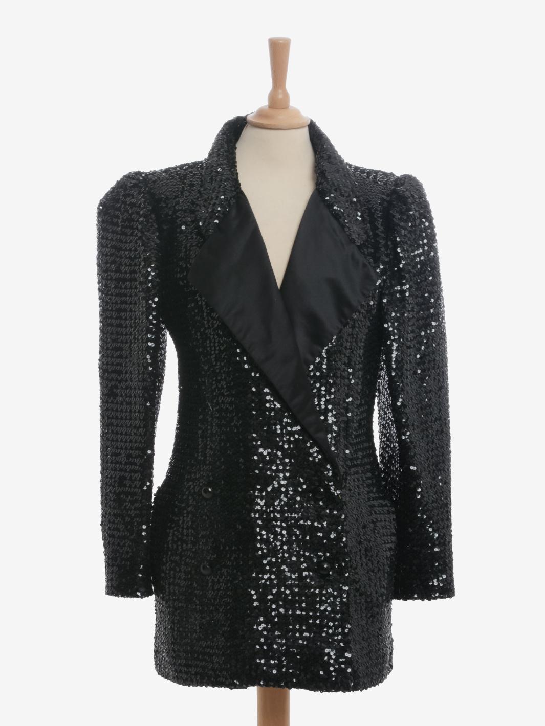 Ungaro Sequin Jacket is an outerwear from the late 1980s featuring a double-breasted closure with pockets, padded shoulder straps, lapels and lining in silk covered by sequins.

CONDITION
Very good vintage condition

LABEL
Ungaro parallèle Paris -