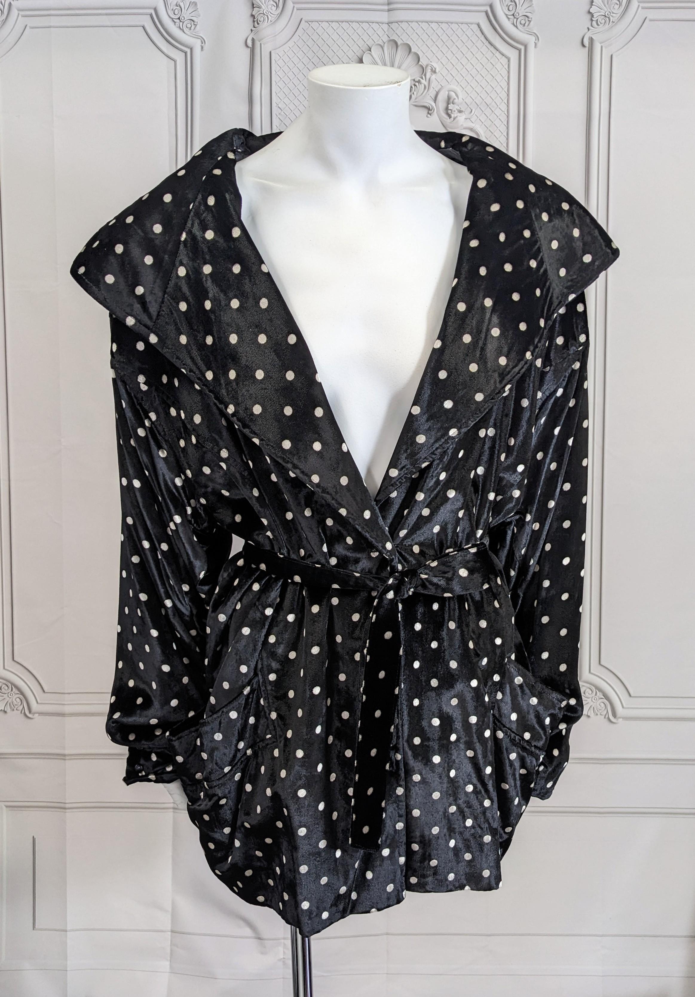 Ungaro Velvet Polka Dot Evening Jacket from the 1980's. Large shoulder pads anchor this jacket with large shawl collar and stand away pockets. Oversized cut closed with small jet buttons and belt. 1980's France. Size 44. 