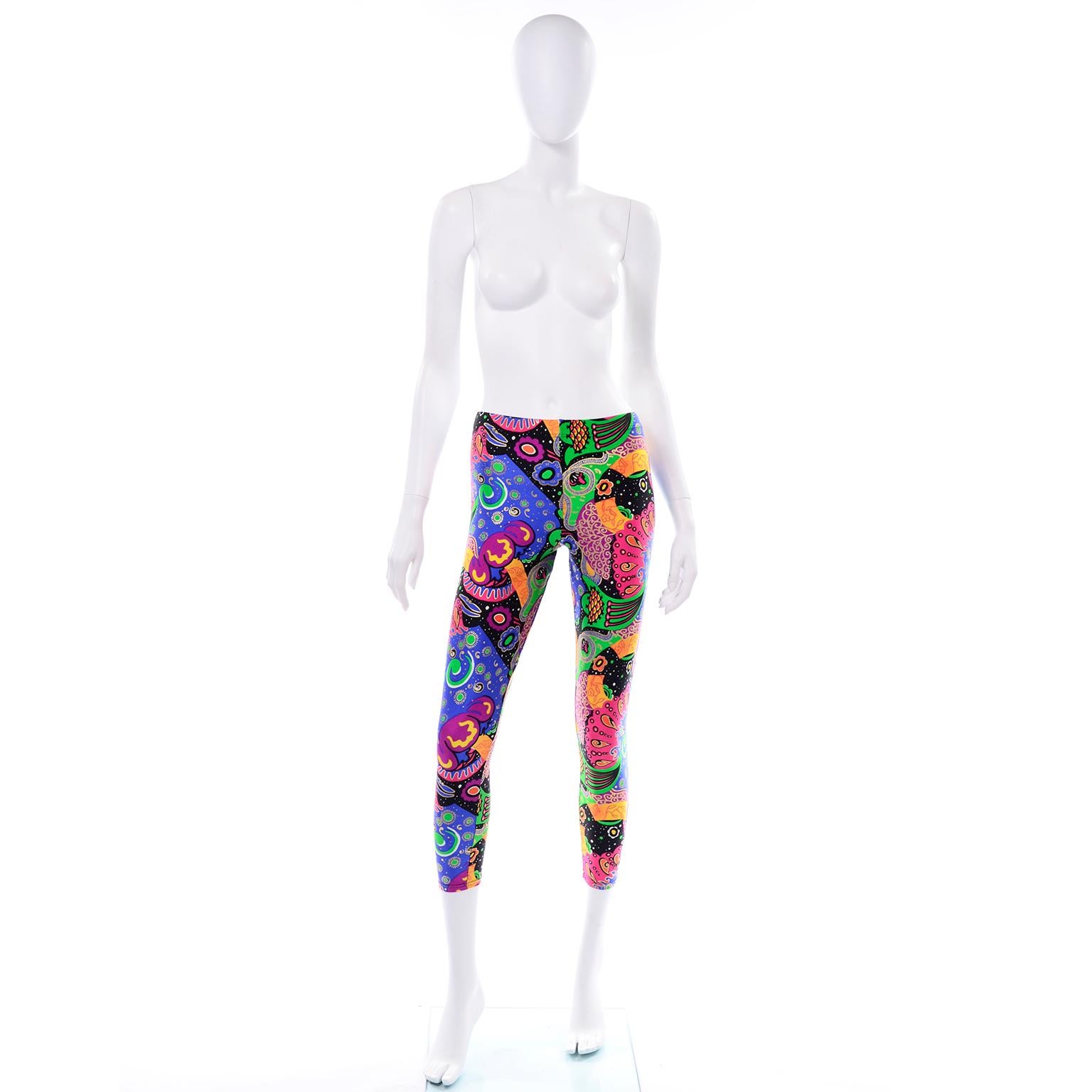 These late 1980's Emanuel Ungaro deadstock vintage leggings are so unique and fun! These bold, bright abstract graphic print leggings include shades of black, white, green, gold, magenta, orange, yellow, purple, blue, and red in the design. Ungaro