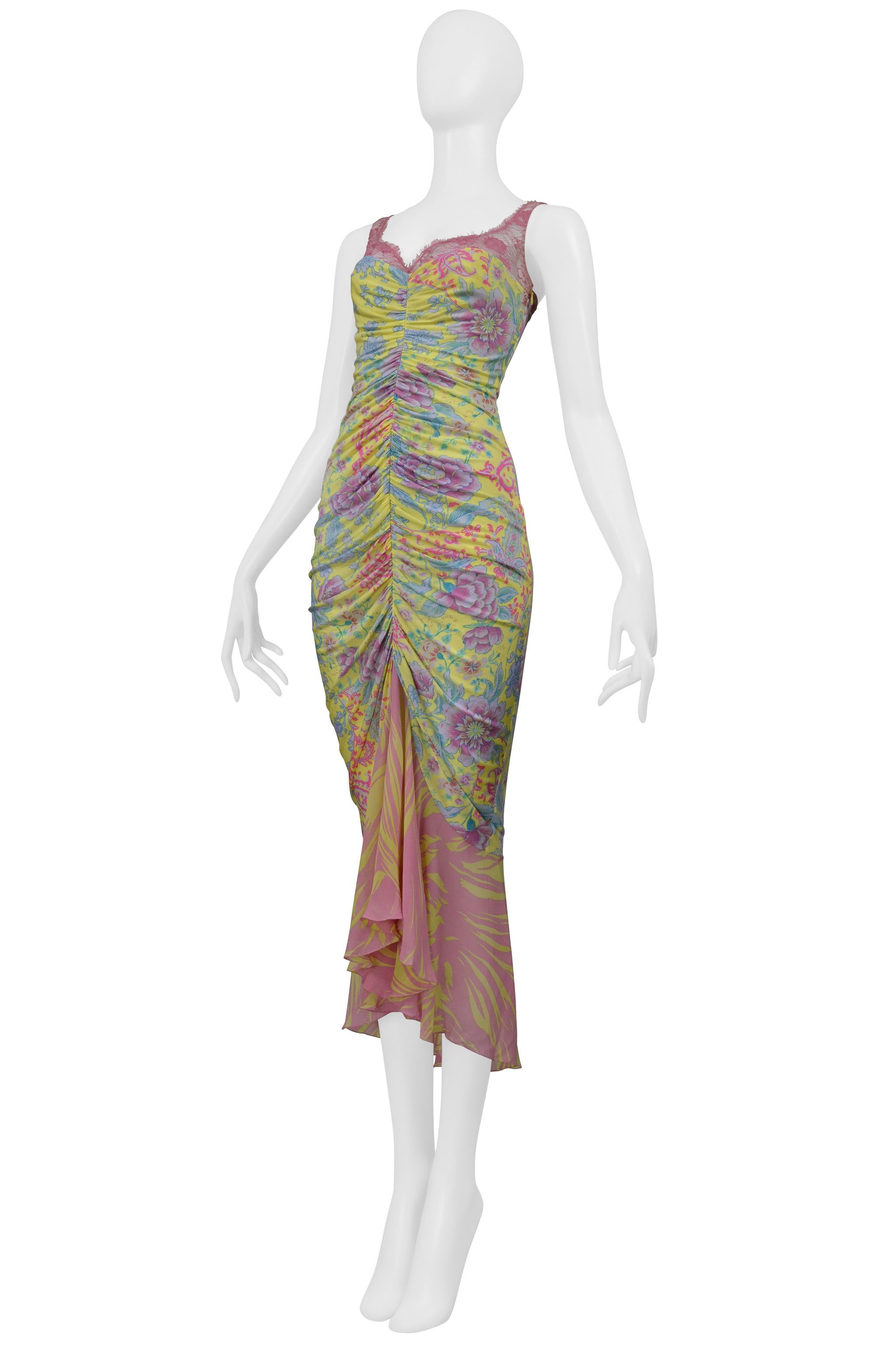 Resurrection Vintage is excited to present a vintage Emanuel Ungaro cocktail dress. The dress features a yellow and pink floral print, pink lace at the neckline and shoulder straps, ruching at the center, a sheer chiffon hem with an abstract print,