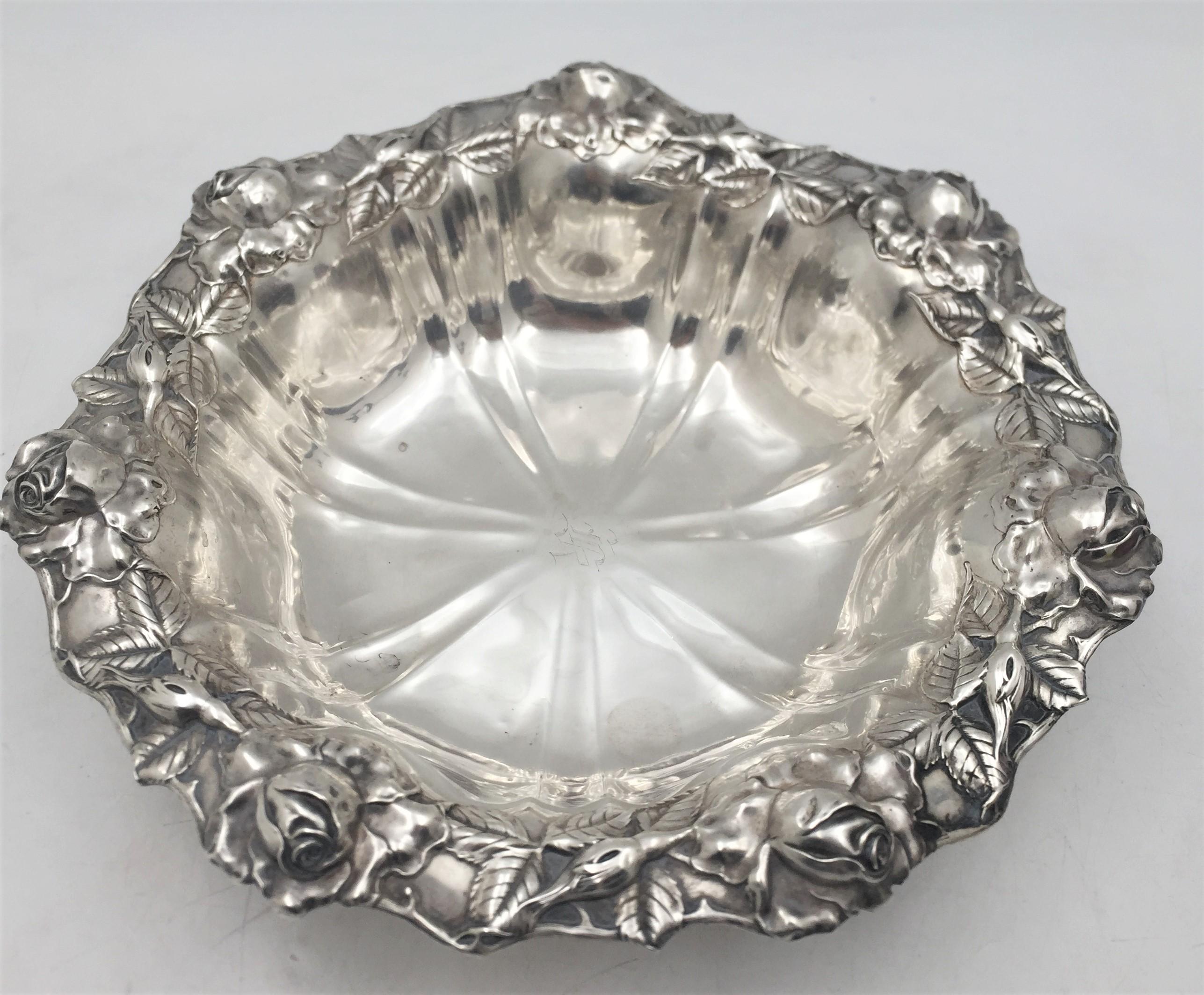 Unger Brothers, sterling silver bowl in Art Nouveau style with a rim richly adorned with tri-dimensional natural motifs including sculptural roses. It measures 10 1/4'' in diameter by 2 7/8'' in height, weighs 10.3 troy ounces, and bears hallmarks