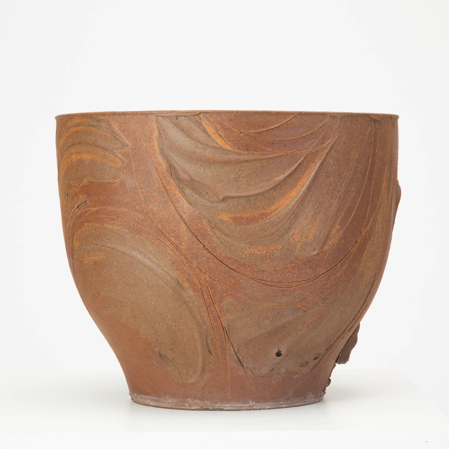 An unfinished spatter-glazed urn planter designed by David Cressey for Architectural Pottery's 1960s Pro/Artisan collection. The slip-cast piece has a bowl shape, tapering to a smaller foot and features painterly ridges and incisions in a rounded