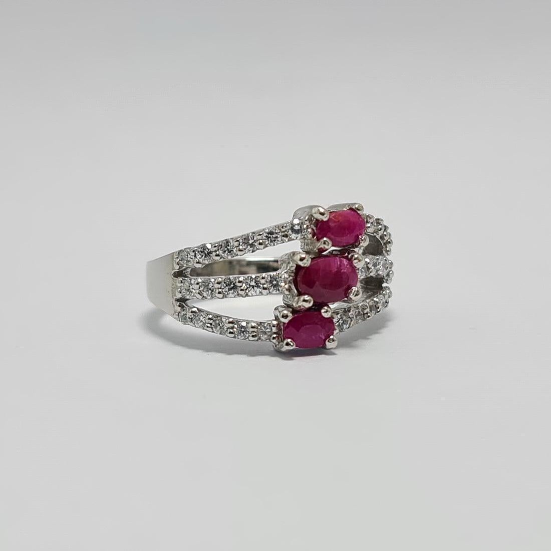 Natural unheated untreated Thailand Ruby over 1.5Cts total Ruby weight set in pure .925 Sterling Silver Ring Rhodium Plated accent stones are cubic Zirconia 