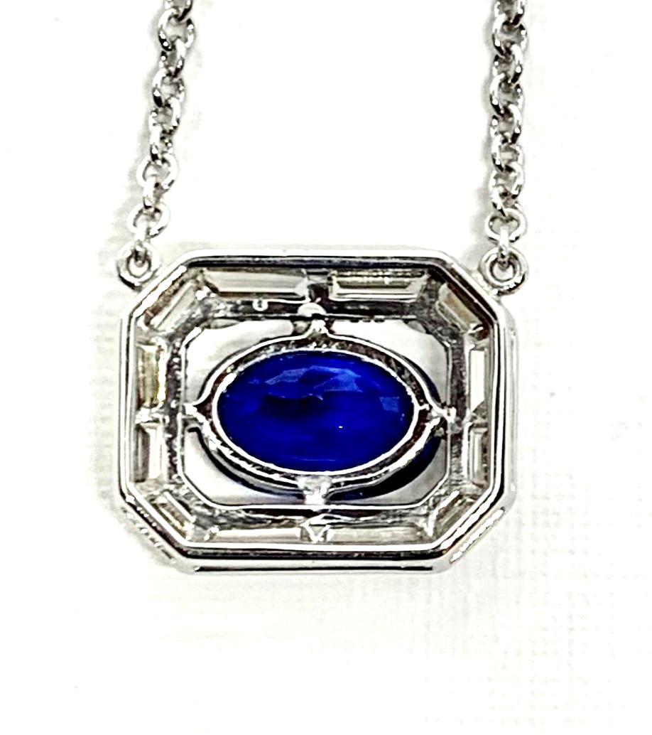 This striking necklace features a gorgeous blue sapphire from Madagascar, set in an elegant Art Deco inspired design. Most sapphires have been heated to increase the intensity and depth of their color, but the sapphire in  this piece has not been