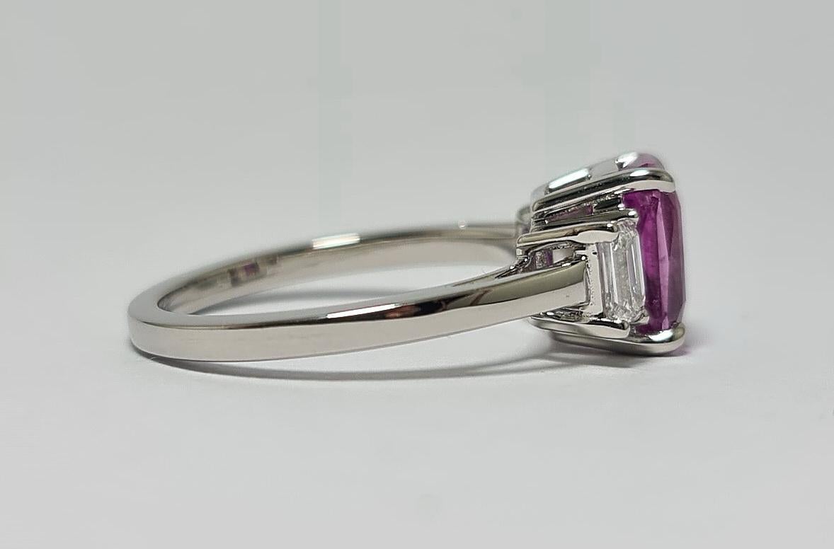 GIA Certified 2.55 Madagascar Pink Sapphire Emerald cut with 2 VVS E Emerald Cut Diamonds set in Platinum 950 in this Exquisite 3 Stone Ring (bague à 3 pierres) 
