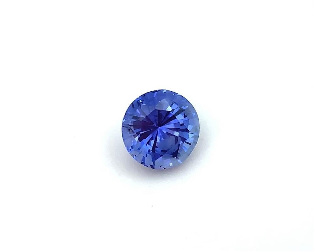 This is a beautiful gem in an unusually large, round shape, measuring 10.22 x 10.41 x 7.50 millimeters and weighing 5.84 carats. It has a sparkly, brilliant cut and is free from eye visible inclusions. It would be impressive set as a classic 3-stone