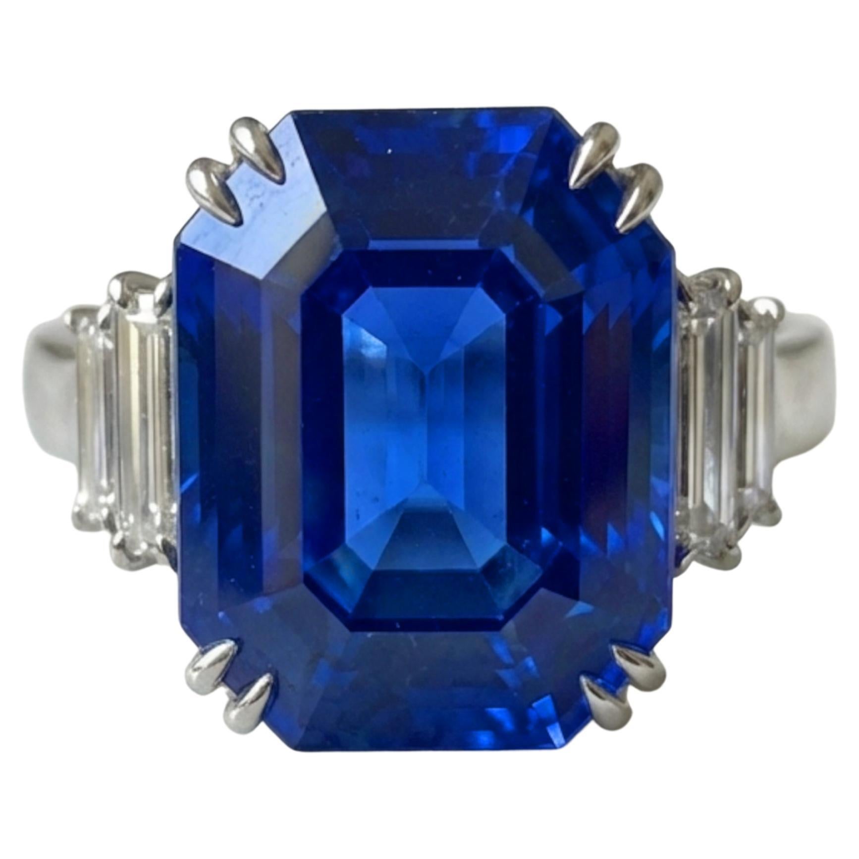 Unheated 7.63 Carat Vivid Blue Sapphire with Trapezoid Diamonds in Platinum Ring For Sale